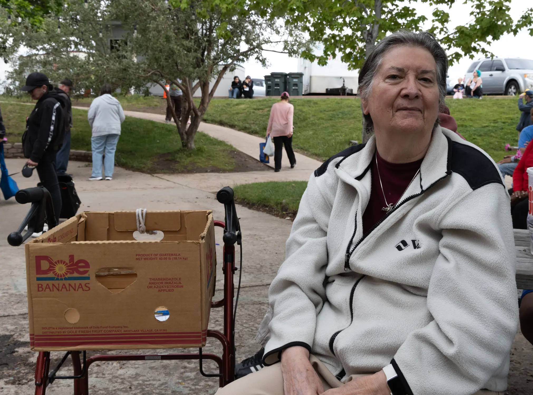 Marge Collum waited for volunteers to call her number, signaling her turn to shop in the food pantry. Each household gets one box of food per week. Photo: Carly Rose, Rocky Mountain PBS