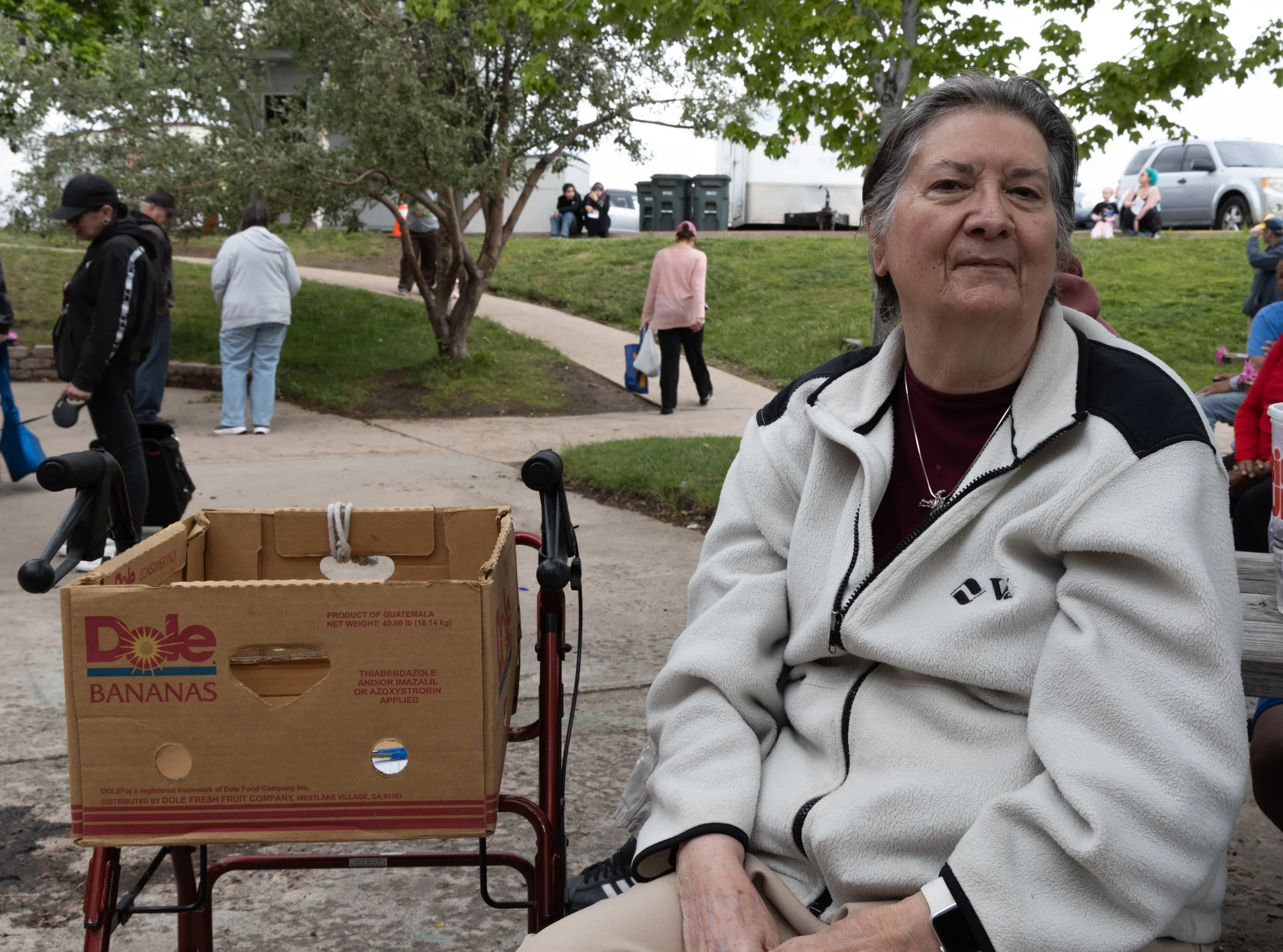Marge Collum waited for volunteers to call her number, signaling her turn to shop in the food pantry. Each household gets one box of food per week. Photo: Carly Rose, Rocky Mountain PBS