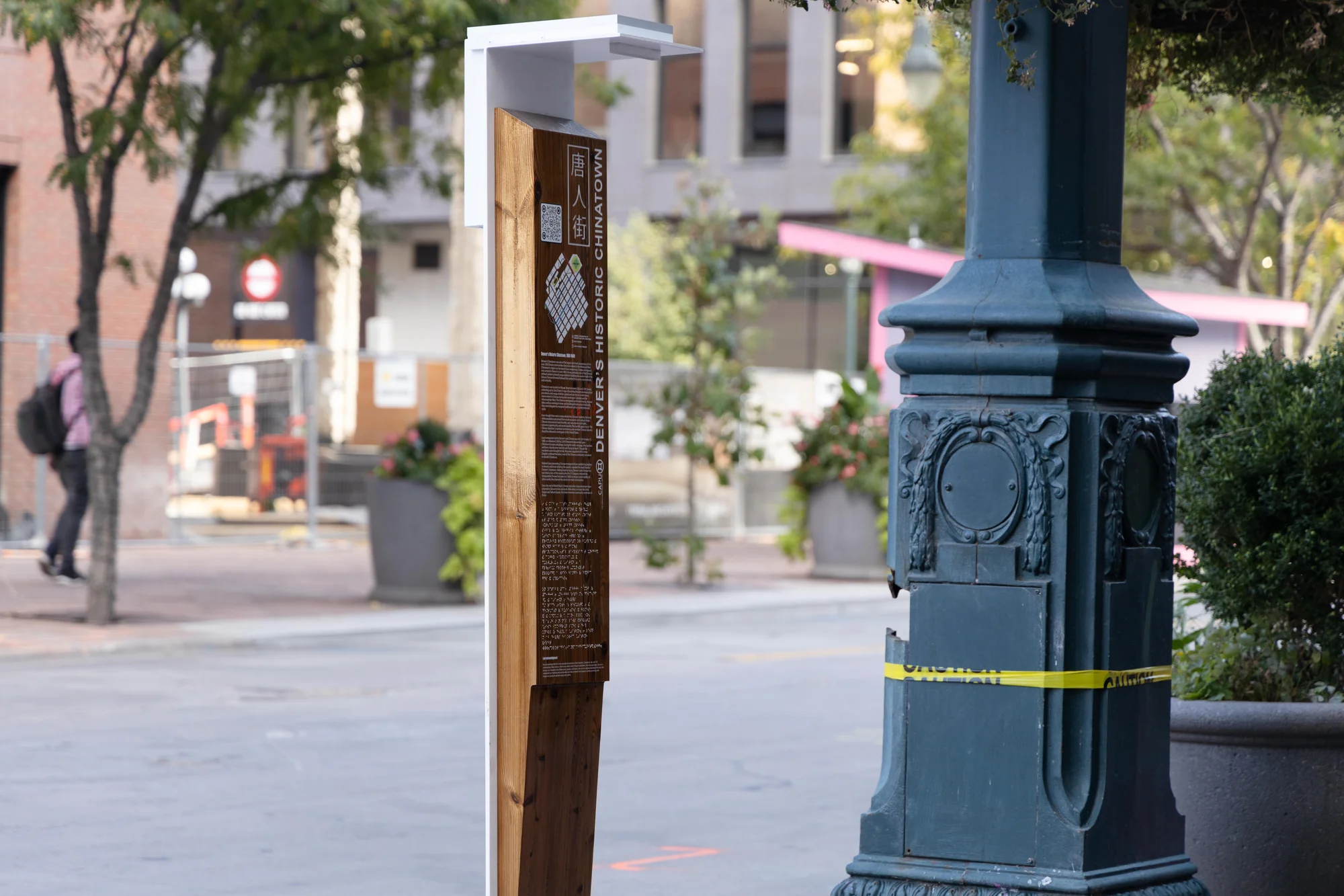 The new marker replacing the missing one stands on 16th Street between Wazee and Blake streets. CAPU made some slight changes, including enlarging the text, reinforcing the back so it’s harder to steal, and adding reflective lighting to prevent cars from hitting it.  Photo: Andrea Kramar, Rocky Mountain PBS