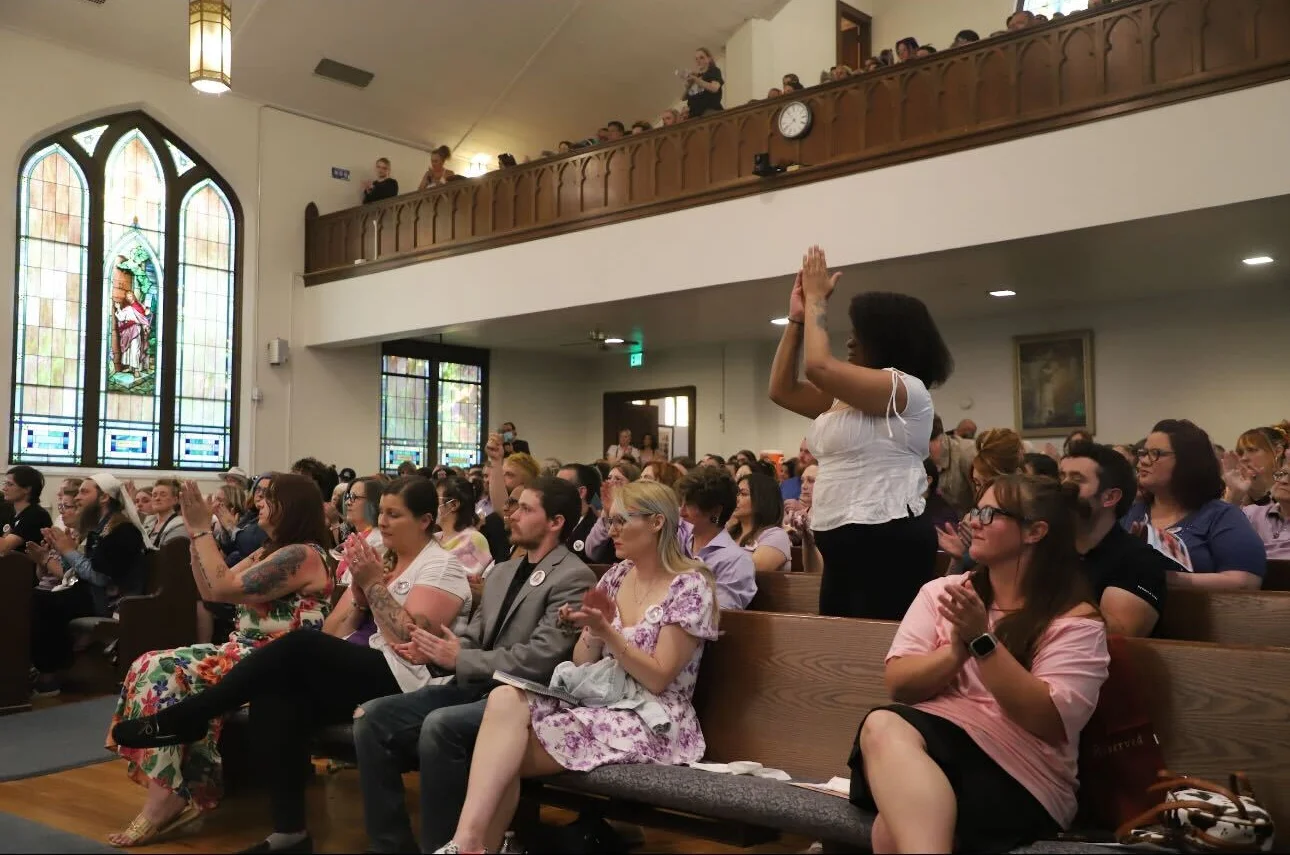 People clap during a celebration of life for Jax Gratton. Photo: Alec Berg, Rocky Mountain PBS