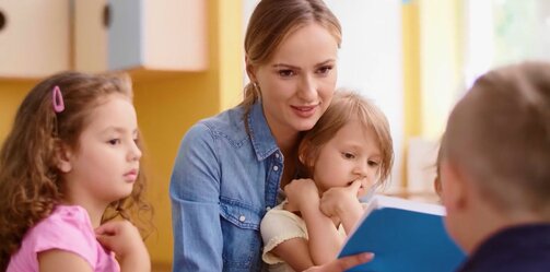 Mom with 2 children reading