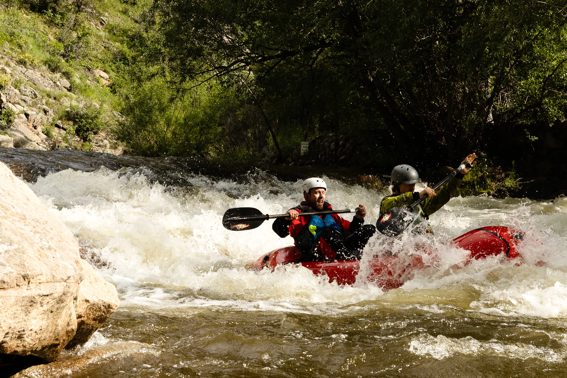 Patrick Mulholland and Quinn Farrell pilot their inflatable packraft down Boulder Creek in early-June.