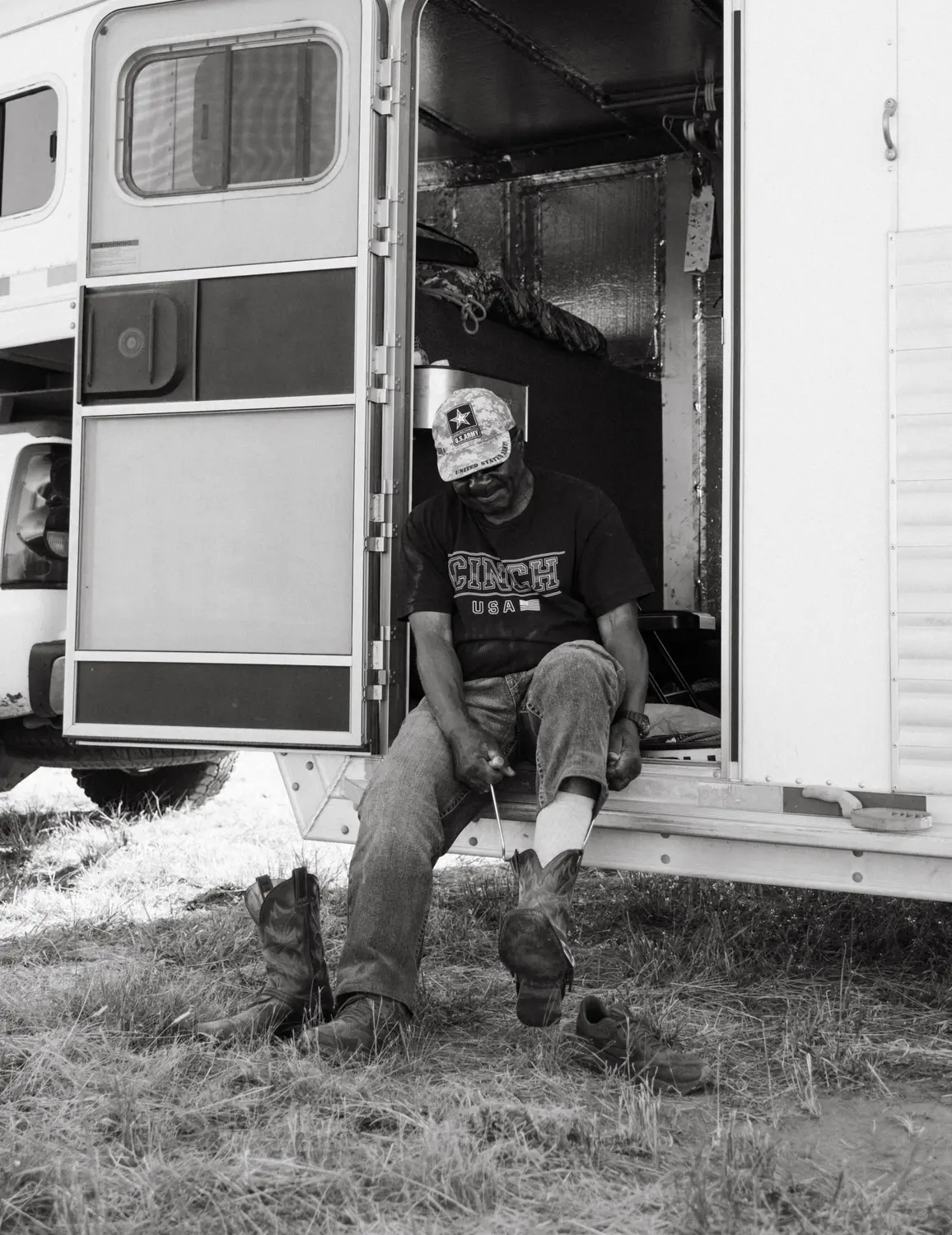  Wade puts on his cowboy boots using boot jacks. Photo: Peter Vo, Rocky Mountain PBS