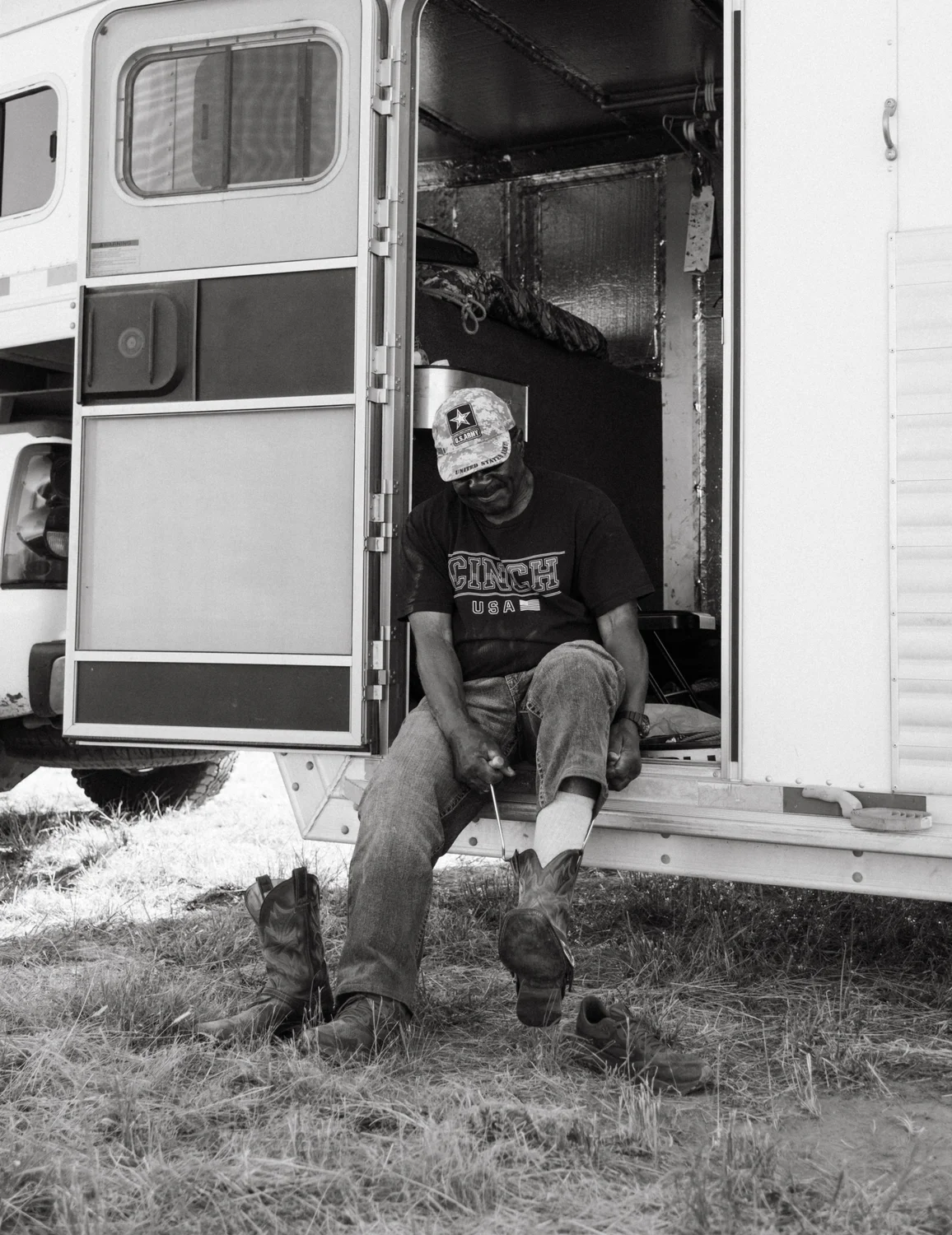  Wade puts on his cowboy boots using boot jacks. Photo: Peter Vo, Rocky Mountain PBS