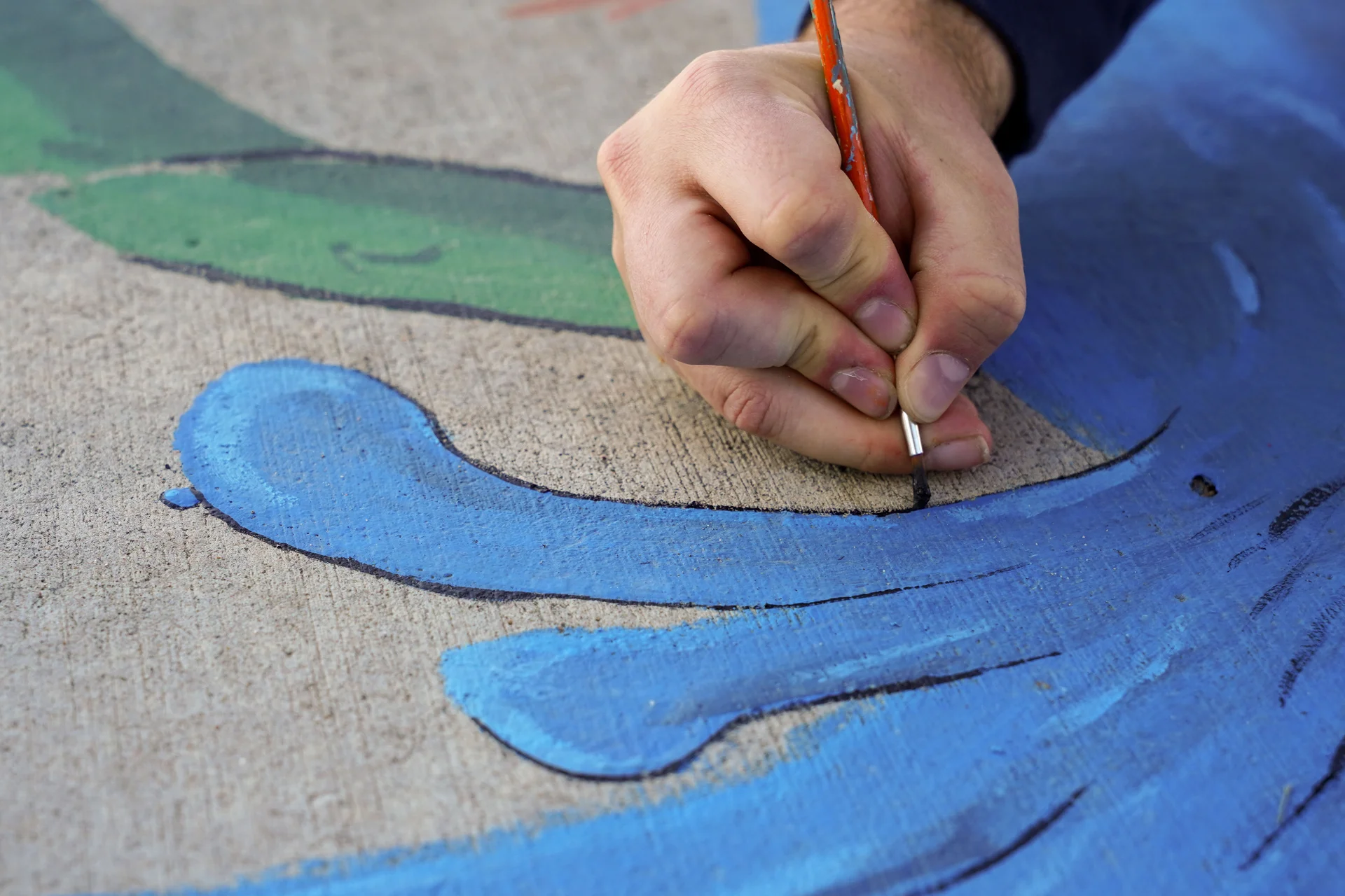 Not pictured: the ants West had to watch out for as he was working on his storm drain art piece. Photo: Joshua Vorse, Rocky Mountain PBS