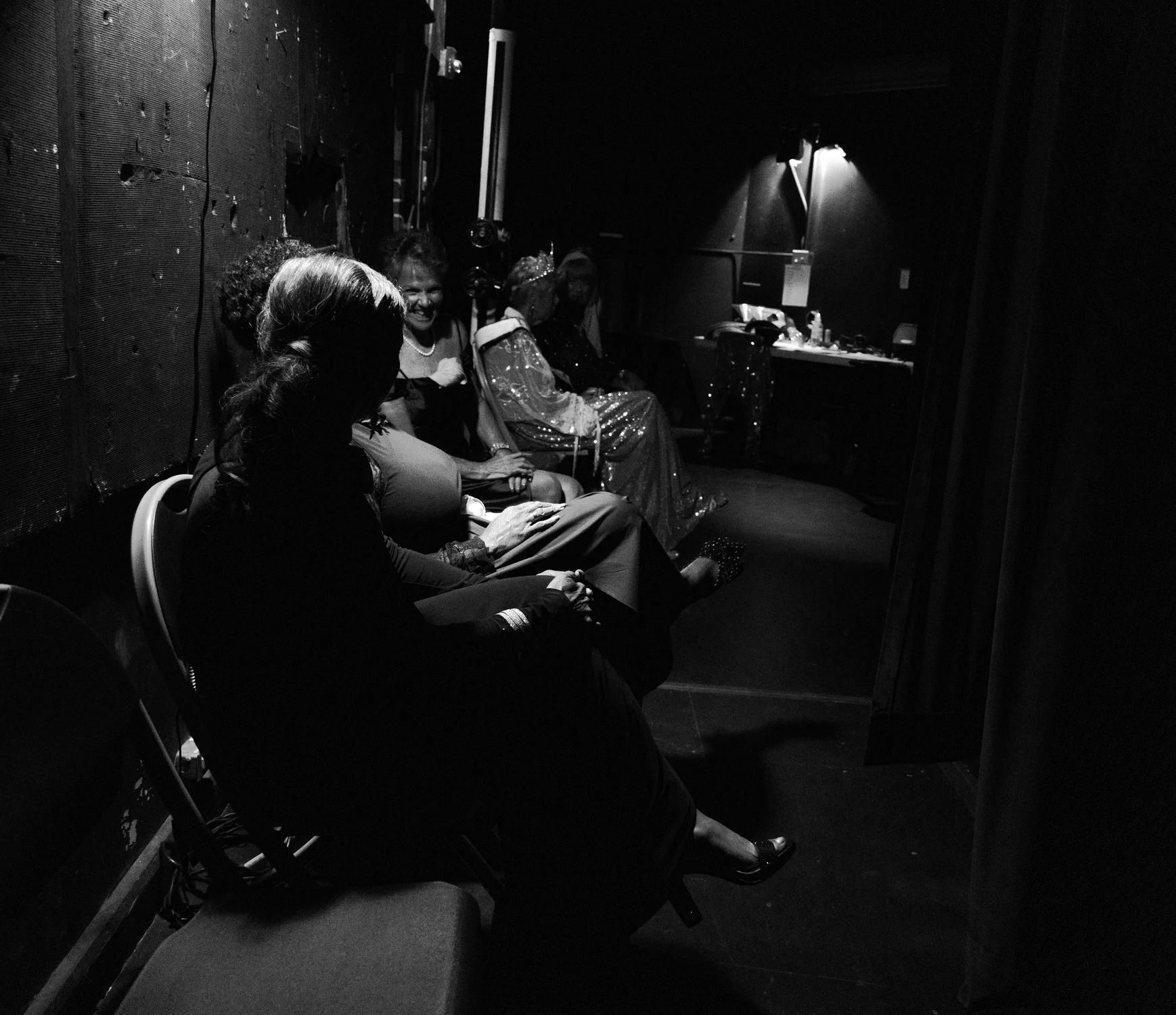 Contestants and former queens participating in the pageant wait backstage before the opening number. Photo: Carly Rose, Rocky Mountain PBS