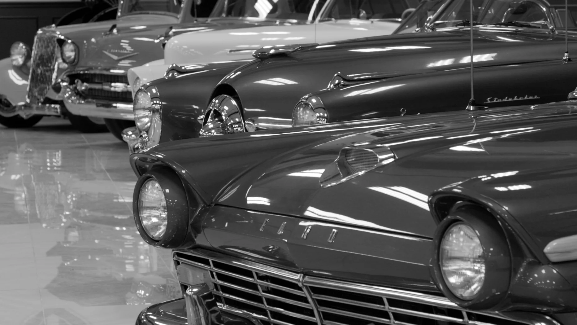 Midcentry cars, like the 50s era Studebaker in the middle, have their own side of the museum. Photo: Joshua Vorse, Rocky Mountain PBS