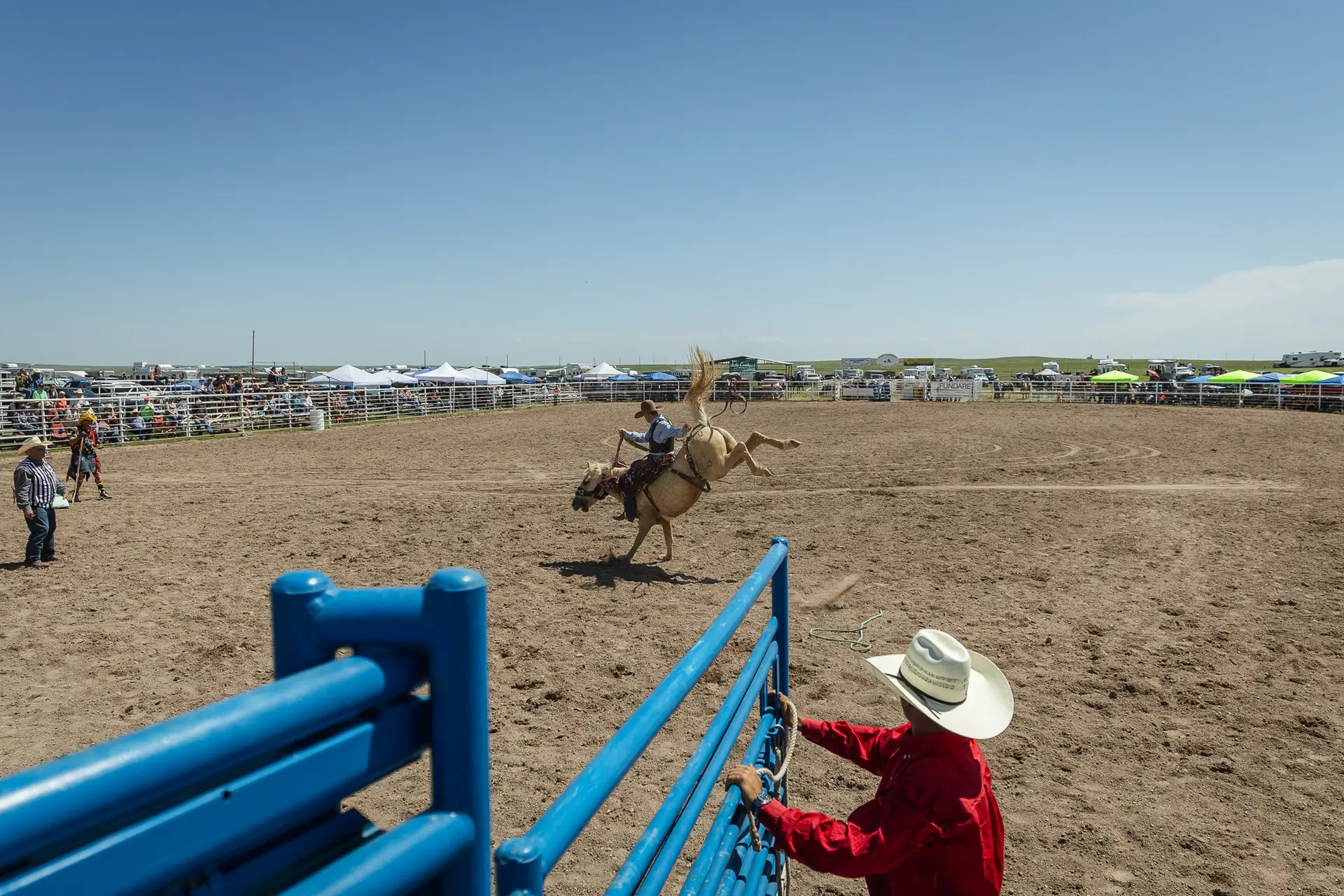 Australian saddle bronc rider, Cody Angland, hangs on.