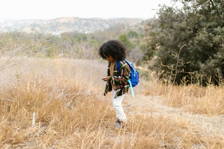 A boy exploring outside.