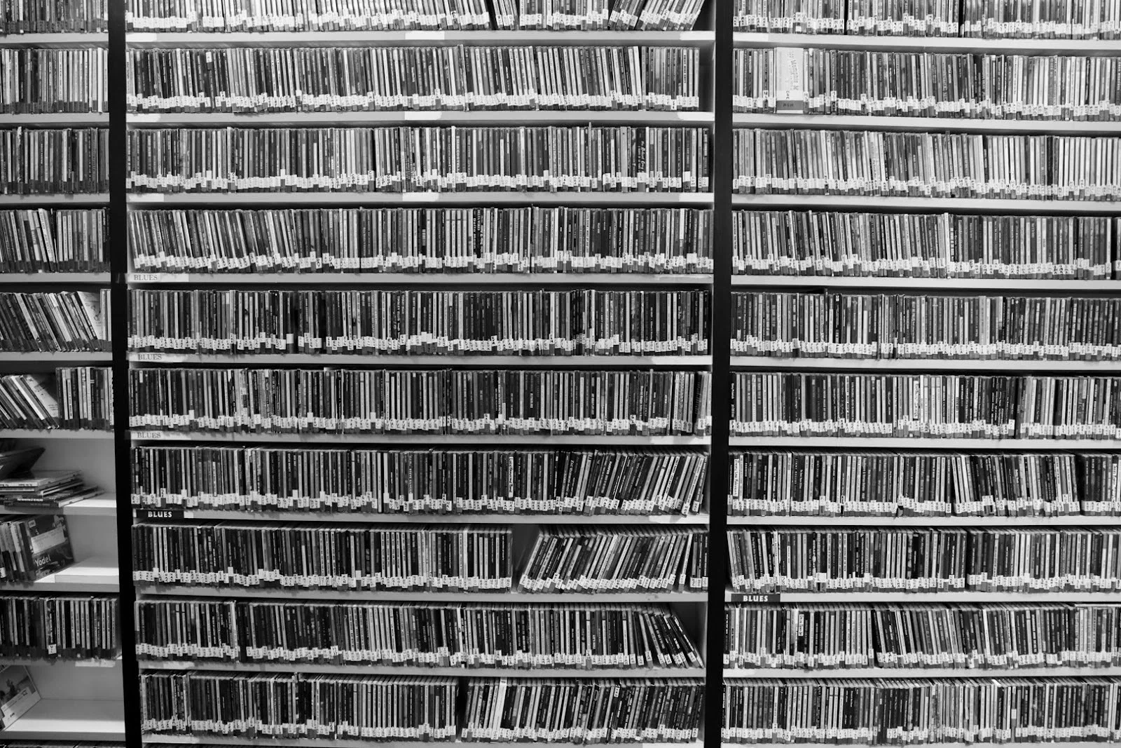 The hallway outside the DJ booths is lined with 40,000 CDs. If a KVNF DJ is unable to find a song online for one of their shows, they often find it in this physical archive. Photo: Joshua Vorse, Rocky Mountain PBS