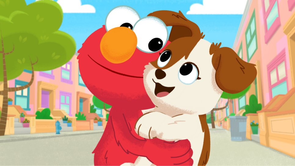 Elmo holding puppy