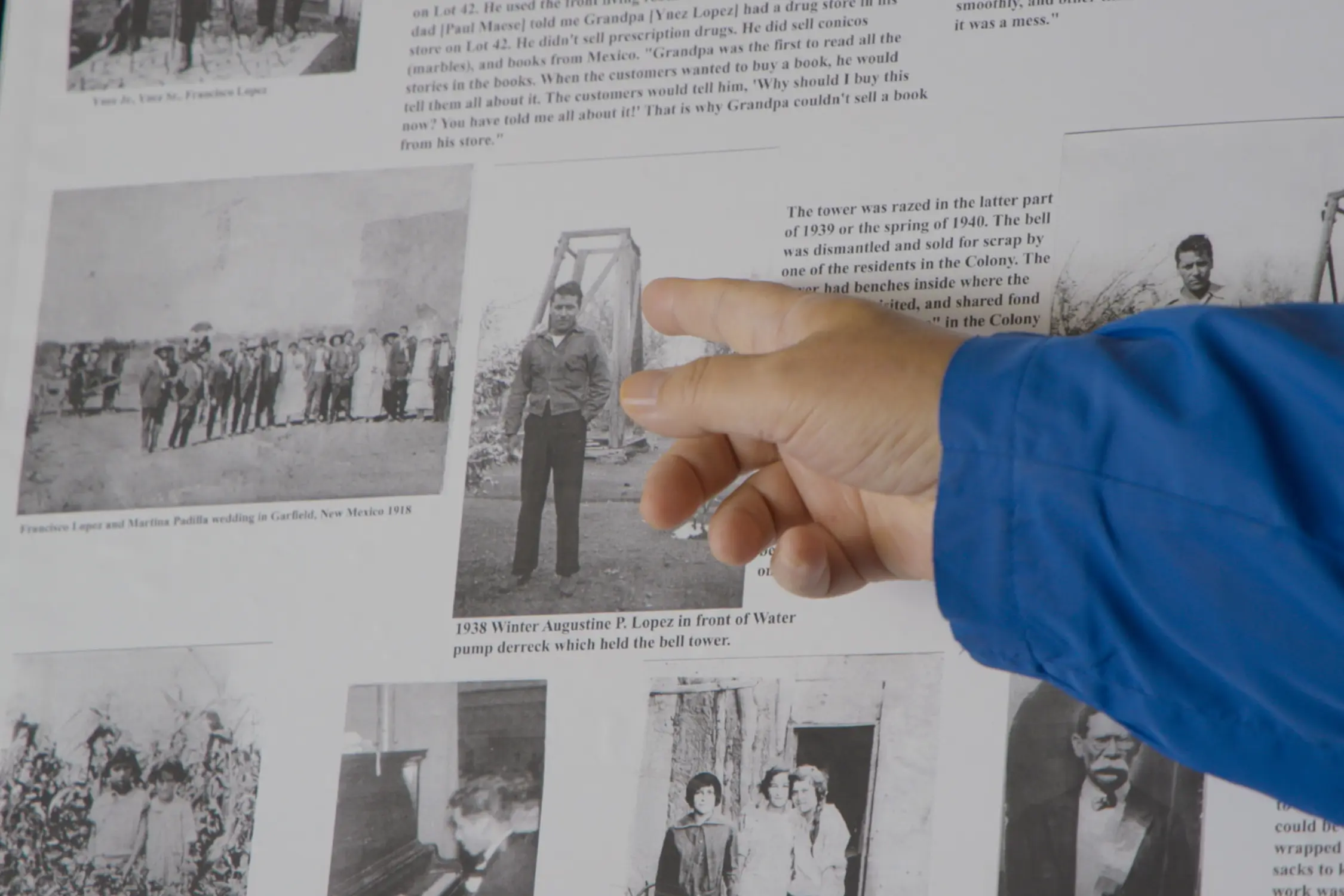 Gabriel Lopez points out his father, Gus Lopez, in a poster board full of family pictures. Photo: Alexis Kikoen, Rocky Mountain PBS