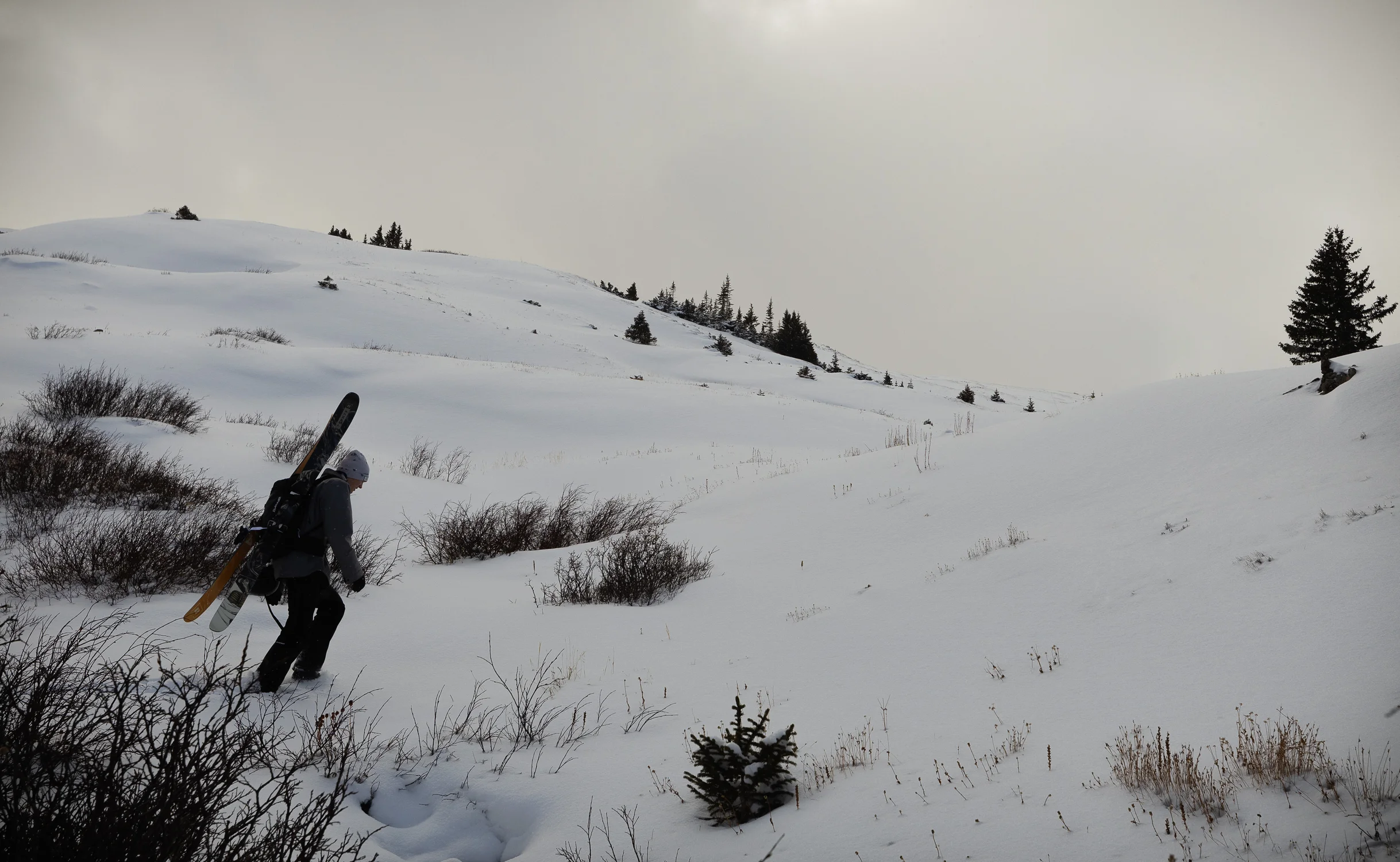 Denny Shaedig hikes to a site at Loveland Pass to gather a snow sample. Photo: Cormac McCrimmon, Rocky Mountain PBS