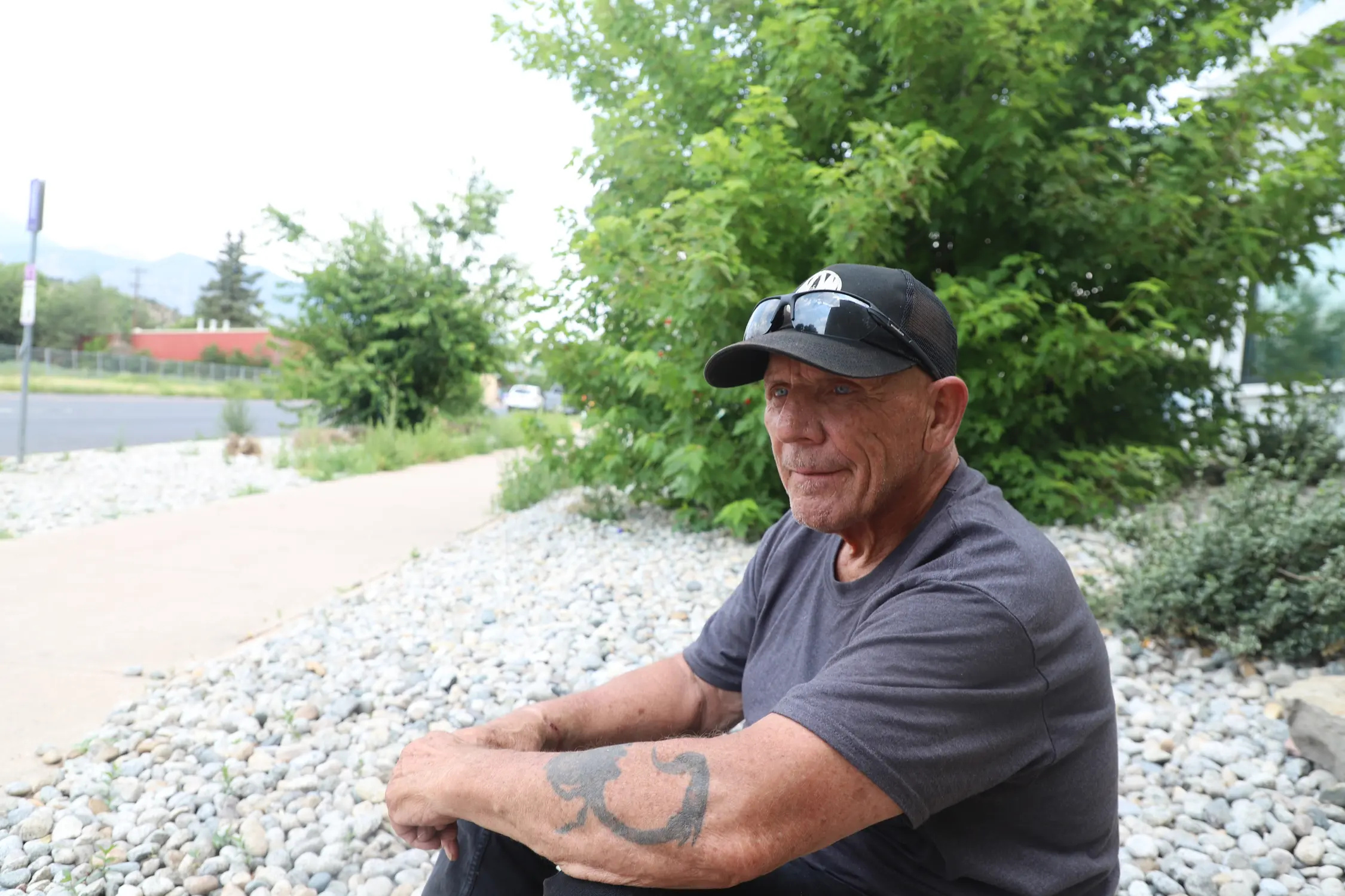 Roger Forney sits outside of West Side Cares. Photo: Alec Berg, Rocky Mountain PBS