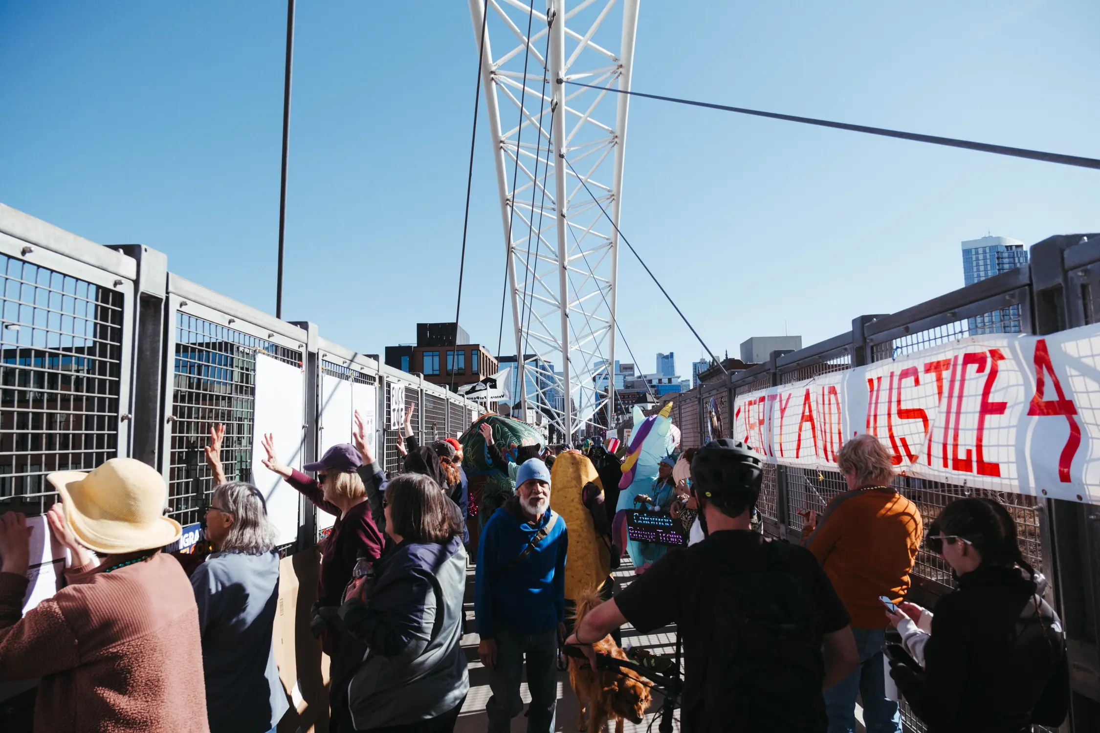 Protesters crowd the bridge on a Saturday afternoon. Photo: Peter Vo, Rocky Mountain PBS