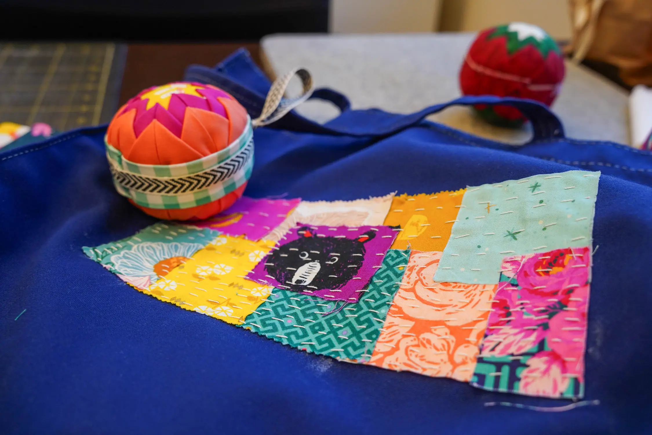 Sashiko patchwork on a tote bag, and no-sew fabric ornaments are some of the projects Powell taught as part of the residency. Photo: Joshua Vorse, Rocky Mountain PBS