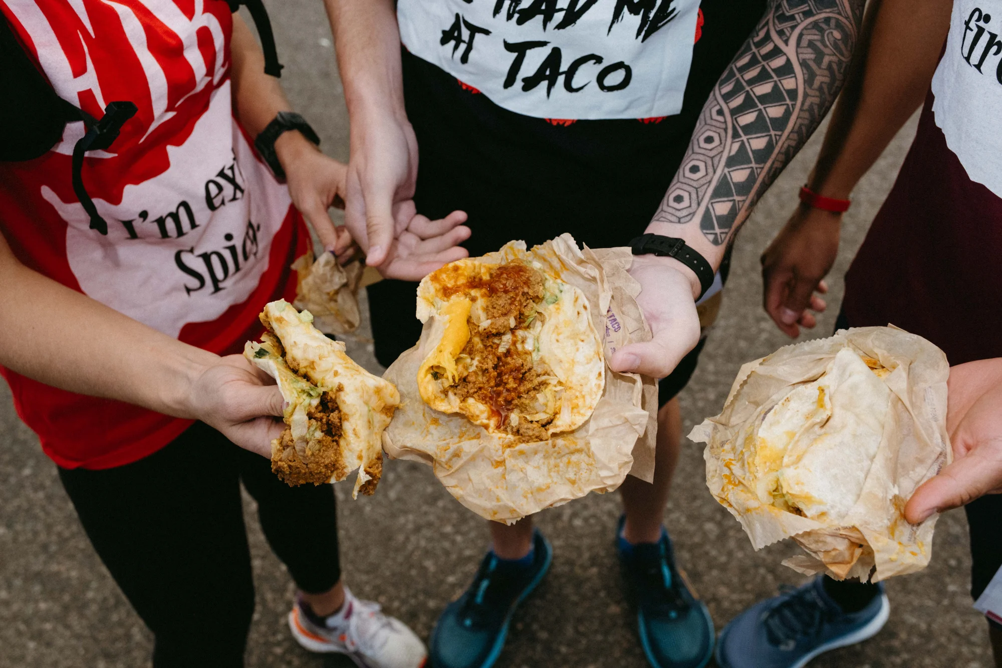 Runners show off their Taco Bell menu items. Photo: Peter Vo, Rocky Mountain PBS
