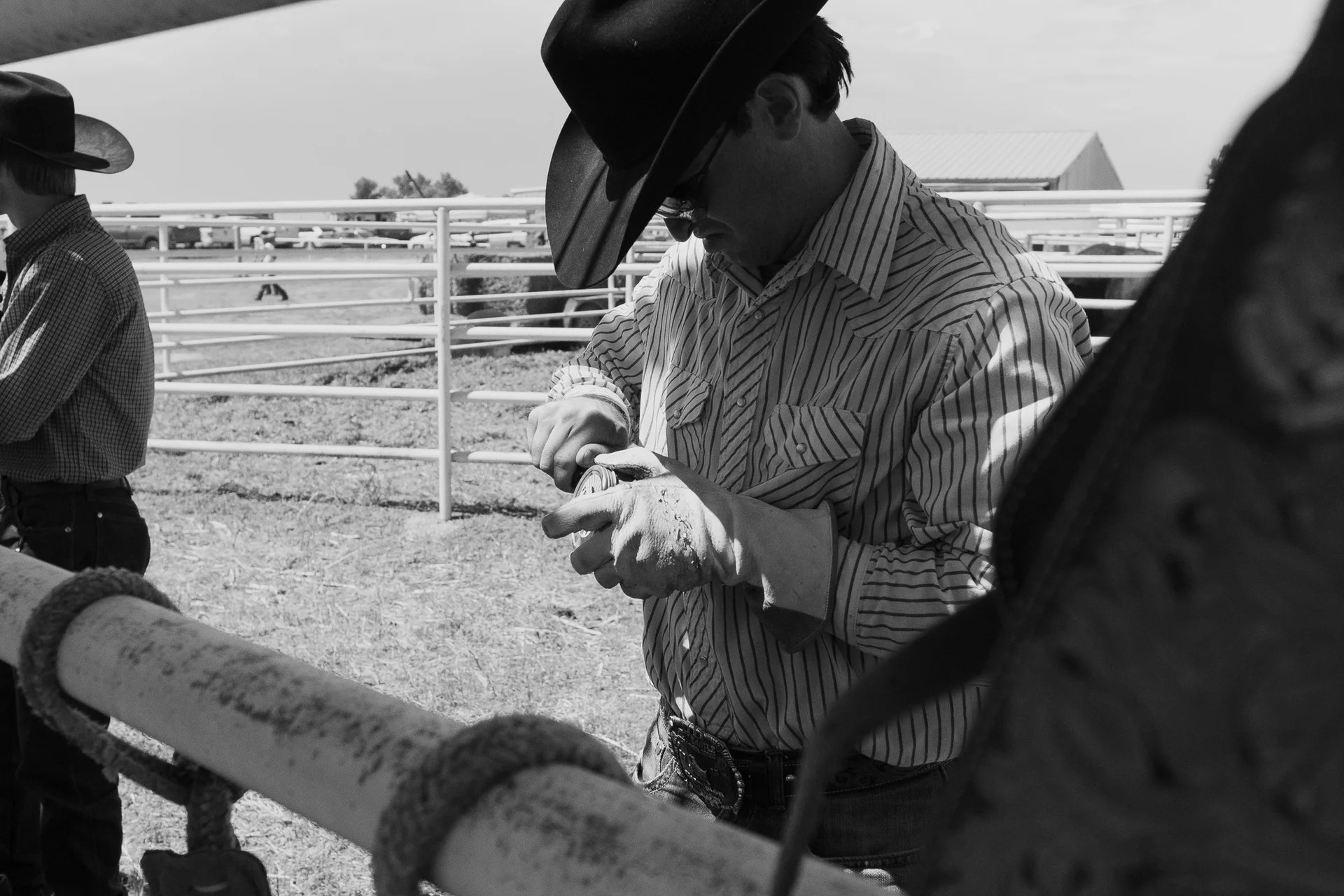 A cowboy prepares to ride.