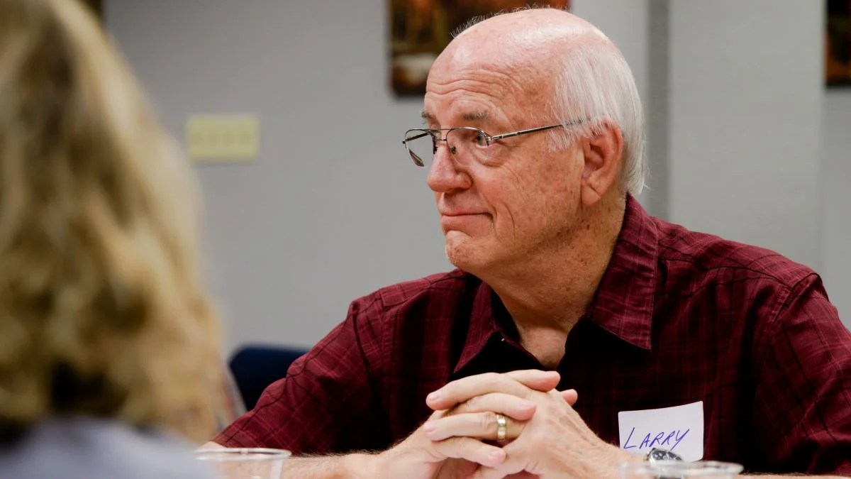 Larry Leisge listens to a fellow participant at a Braver Angels discussion event. Photo: Cormac McCrimmon, Rocky Mountain PBS.