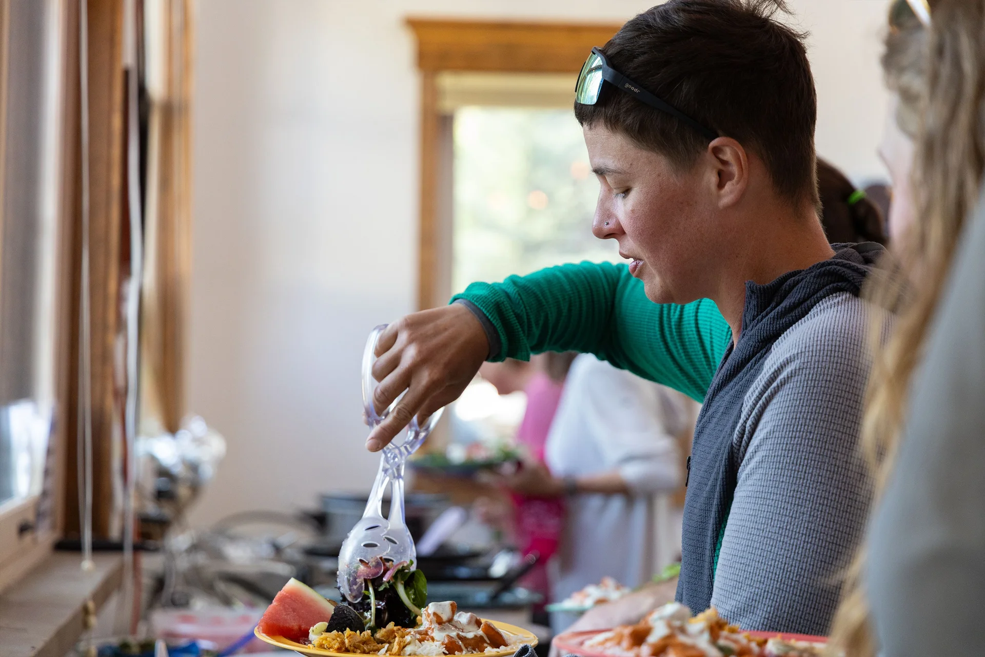 Hikers enjoyed a meal of Sudanese peanut chicken accompanied by a fountain of sour cream-based cucumber sauce. Photo: Chase McCleary, Rocky Mountain PBS