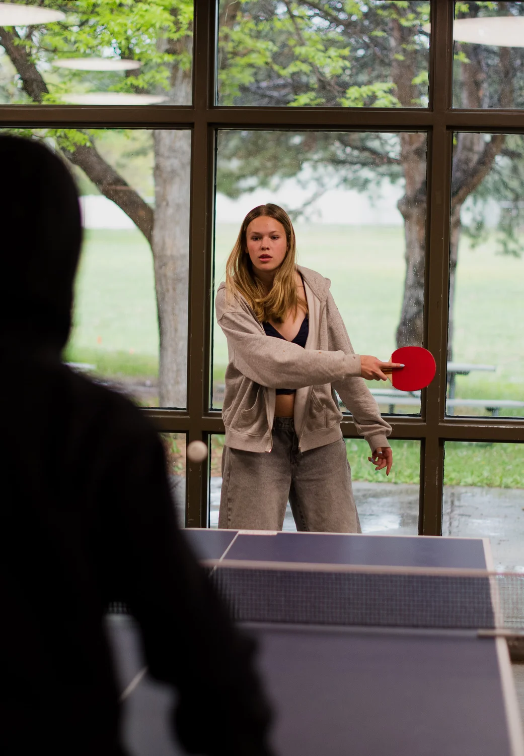 Sophomore Macy Larson said that without her phone, “I didn’t really know what to do.” She started playing basketball during lunch, then ping pong. Photo: Cormac McCrimmon, Rocky Mountain PBS