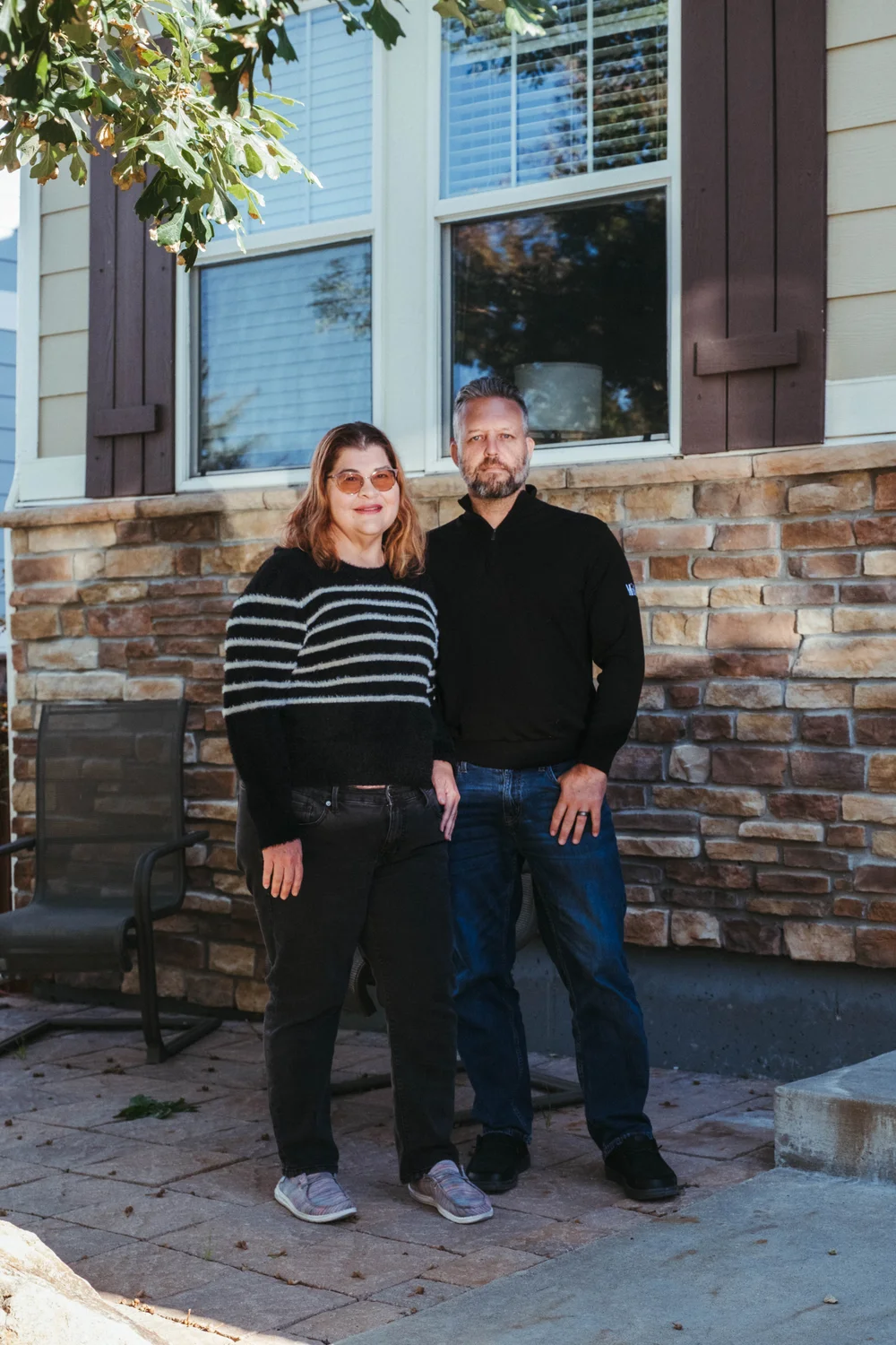 The Daytons pose for a portrait outside their home in Aurora. Photo: Peter Vo, Rocky Mountain PBS