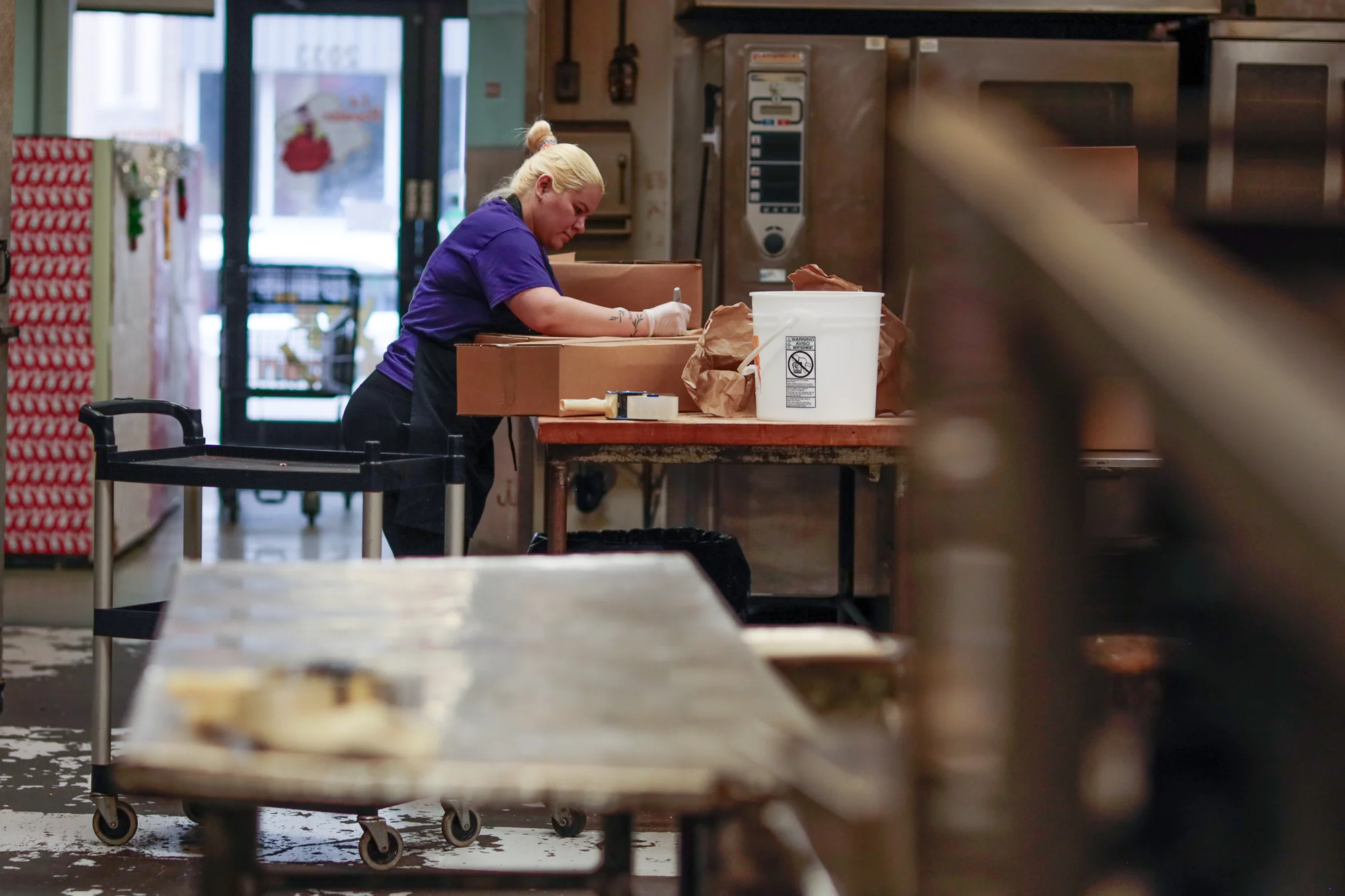 Falenis Mota prepares an order of tamales at La Popular the week before Christmas. Photo: Cormac McCrimmon, Rocky Mountain PBS