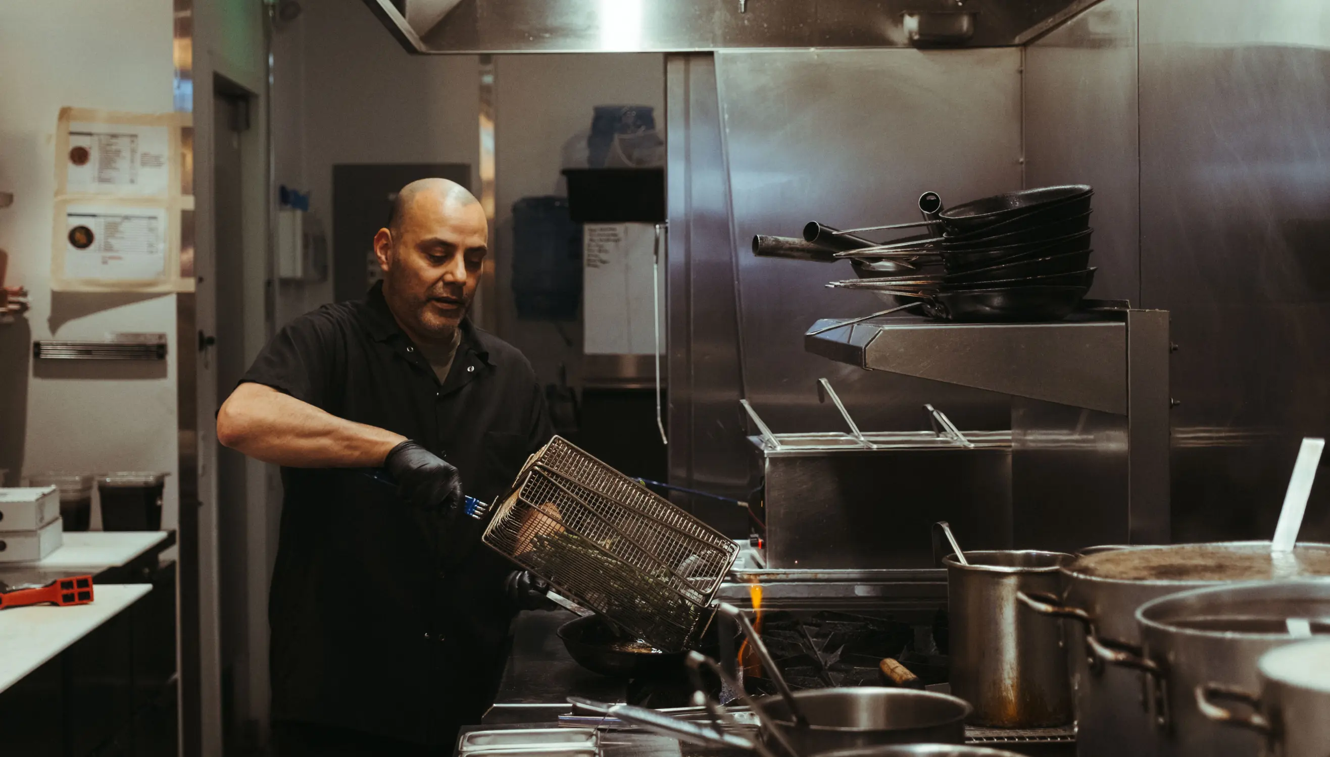 Chef Michael Muñoz serving up the fried green beans, a favorite on Mecha's Restaurant Week menu. Photo: Peter Vo, Rocky Mountain PBS