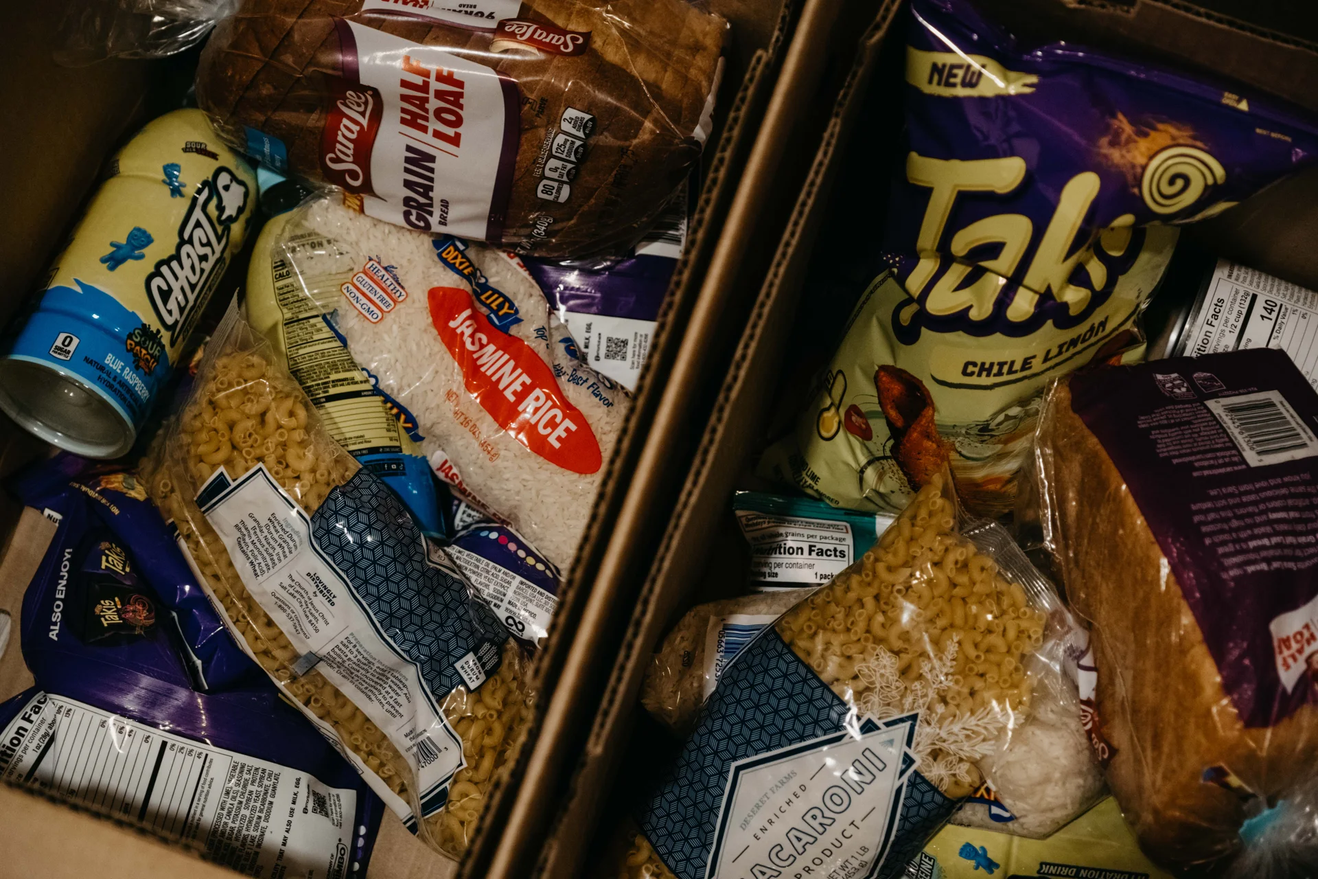 Dry goods like rice, bread and chips are a staple in the food pantry boxes. Photo: Peter Vo, Rocky Mountain PBS