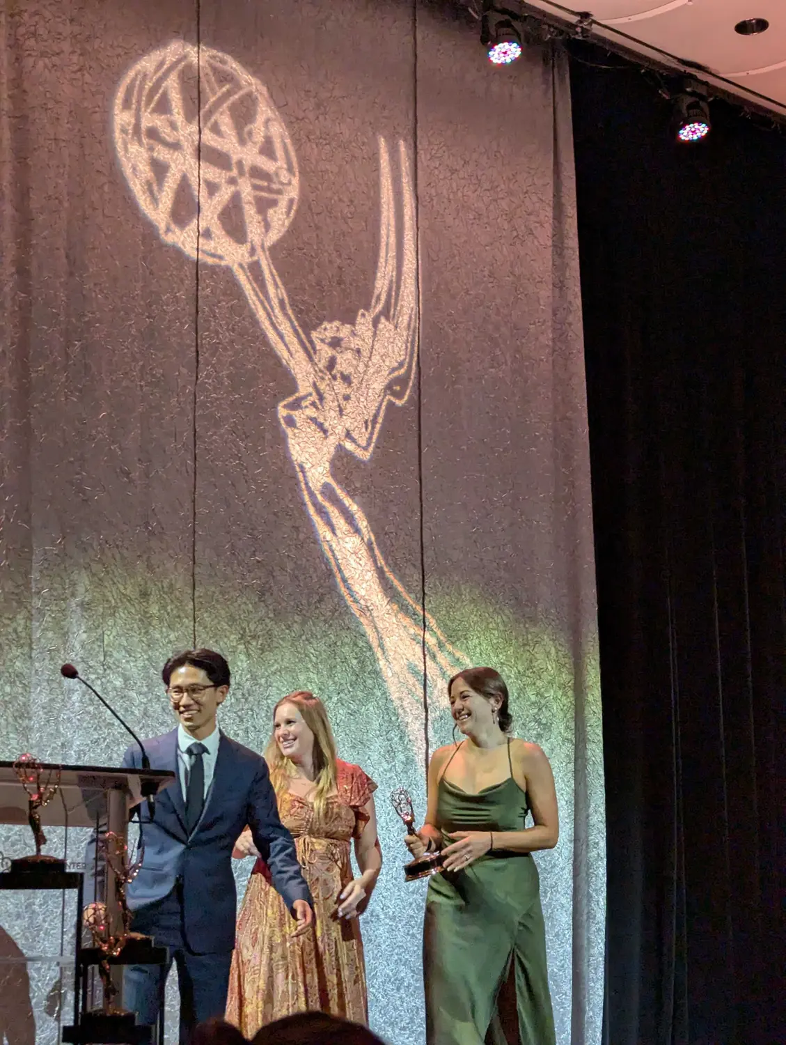 From left to right: Journalists Peter Vo, Alexis Kikoen and Melanie Towler accept their awards at the 2025 Heartland Emmy Awards. Photo: Gabriela Resto-Montero, Rocky Mountain PBS