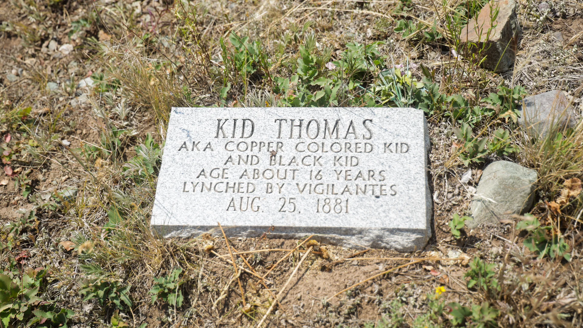 A gravestone for Kid Thomas details his murder by vigilantes. Photo: Ziyi Xu, Rocky Mountain PBS