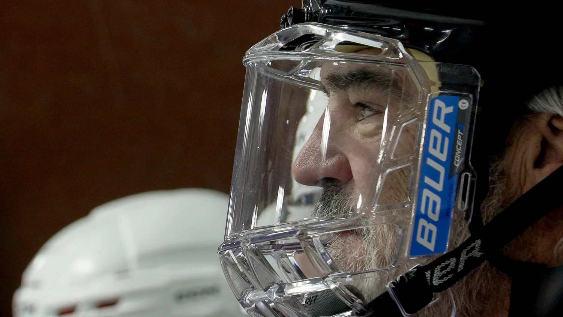 Rick Ellis watches the action from the bench in the first game of the season. Hockey is more like a sprint than a marathon, players are only out on the ice for 60 to 90 seconds. Photo: Joshua Vorse, Rocky Mountain PBS