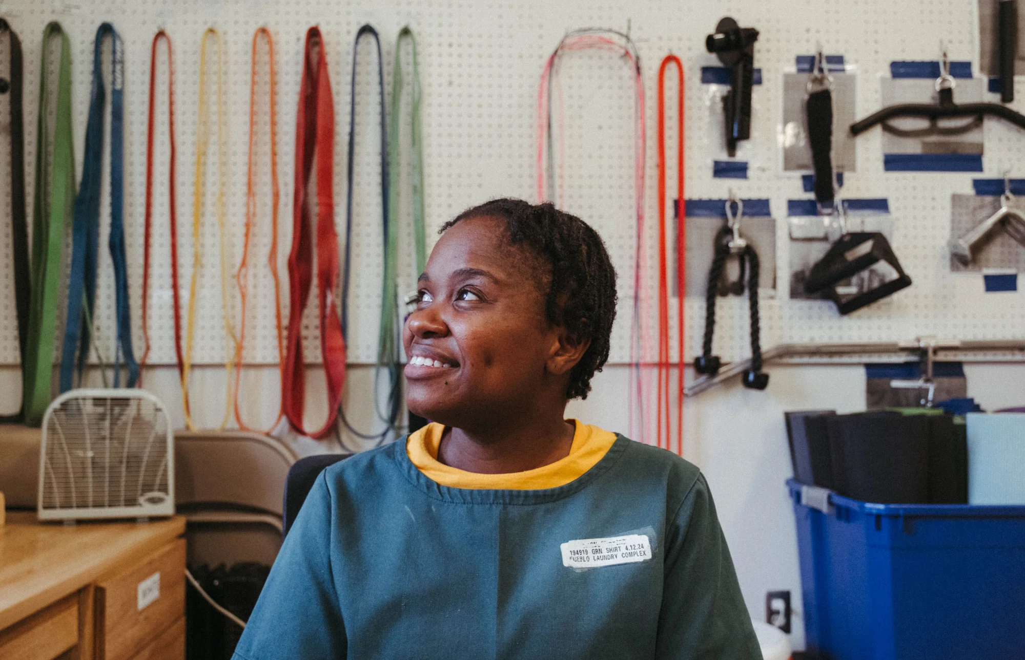 Jael is excited to show her family the work that she’s been putting into the program at the graduation event. Curran-Levett said Jael is “a guiding light” for her classmates. (Rocky Mountain PBS edited this photo to remove Jael’s last name from her nametag.) Photo: Peter Vo, Rocky Mountain PBS