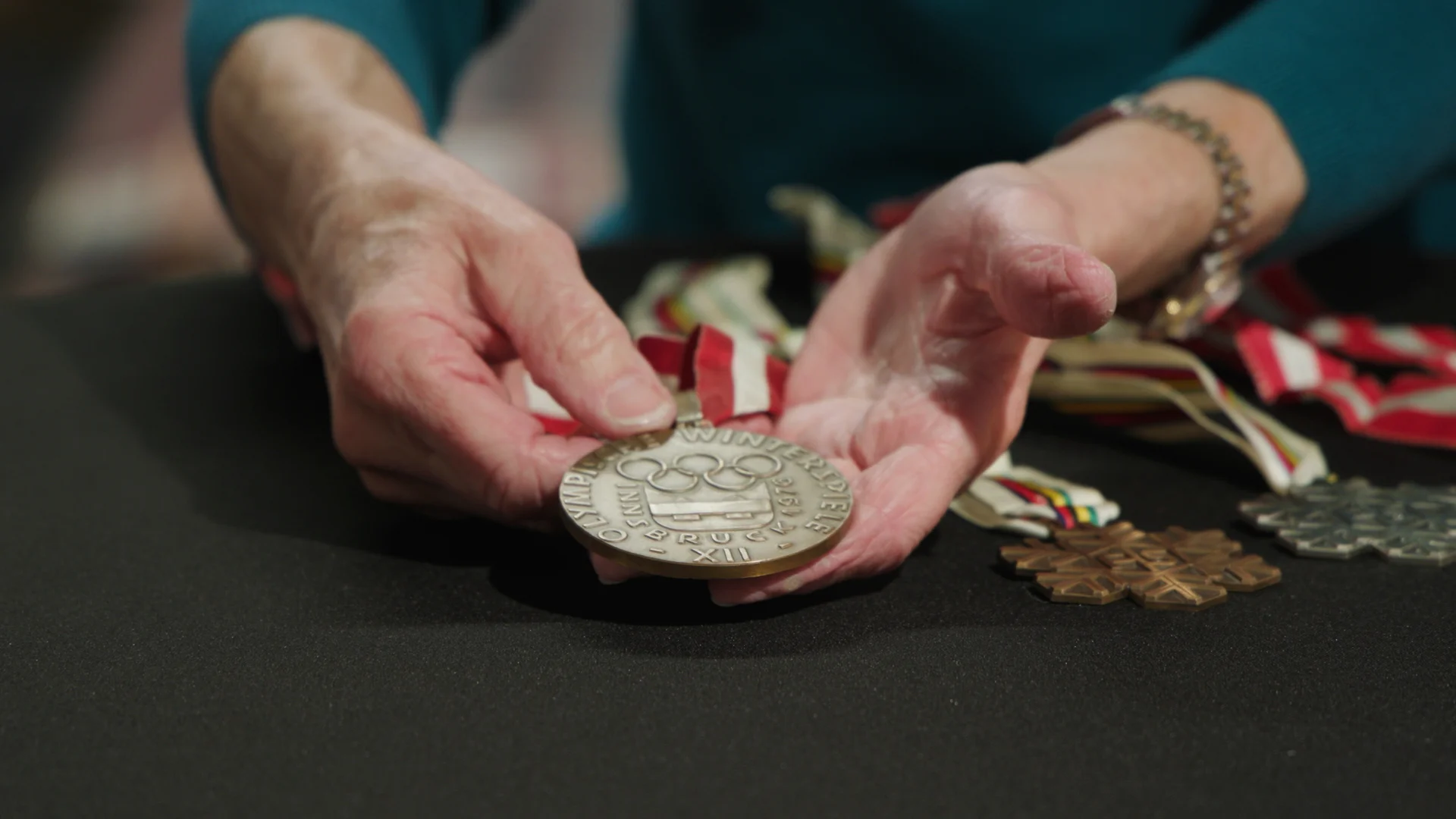 Cindy Nelson holds her bronze medal. Photo: Scott Hennelly, Rocky Mountain PBS