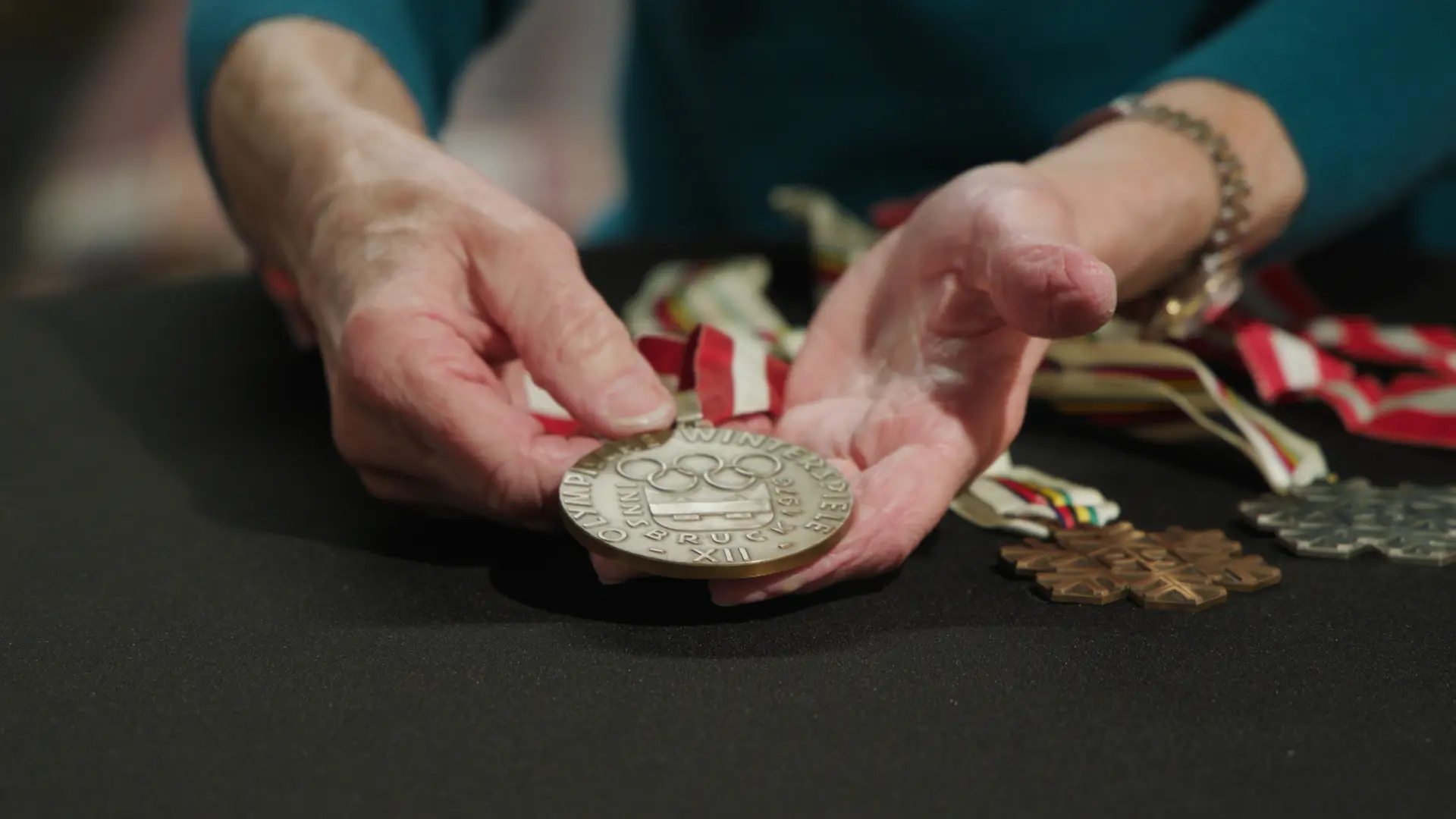 Cindy Nelson holds her bronze medal. Photo: Scott Hennelly, Rocky Mountain PBS