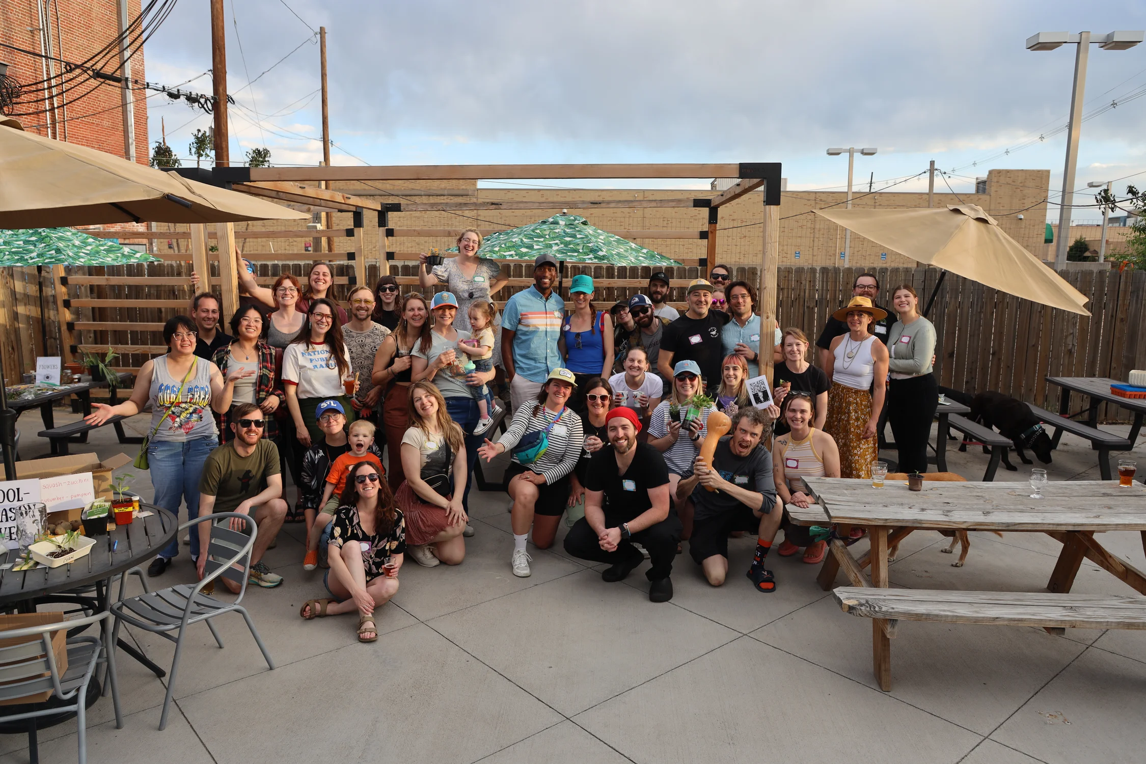 Some of the community members and Corboy, sporting a red bandana in the front row. The vegetable swap was considered a huge success and will happen again on May 5. Photo: Sarah Shoen, Rocky Mountain PBS