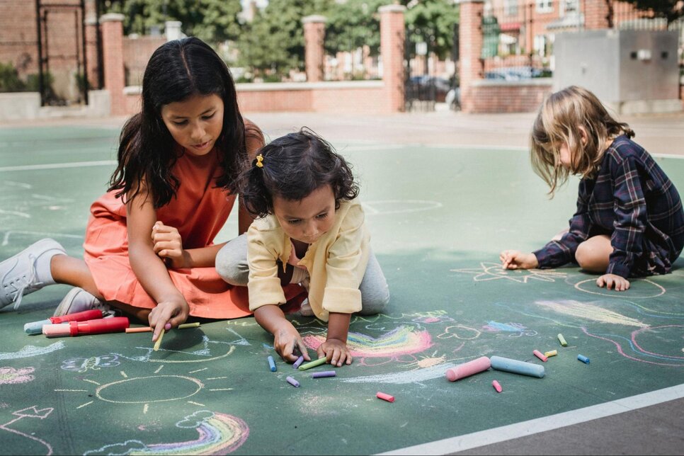 Children making chalk art