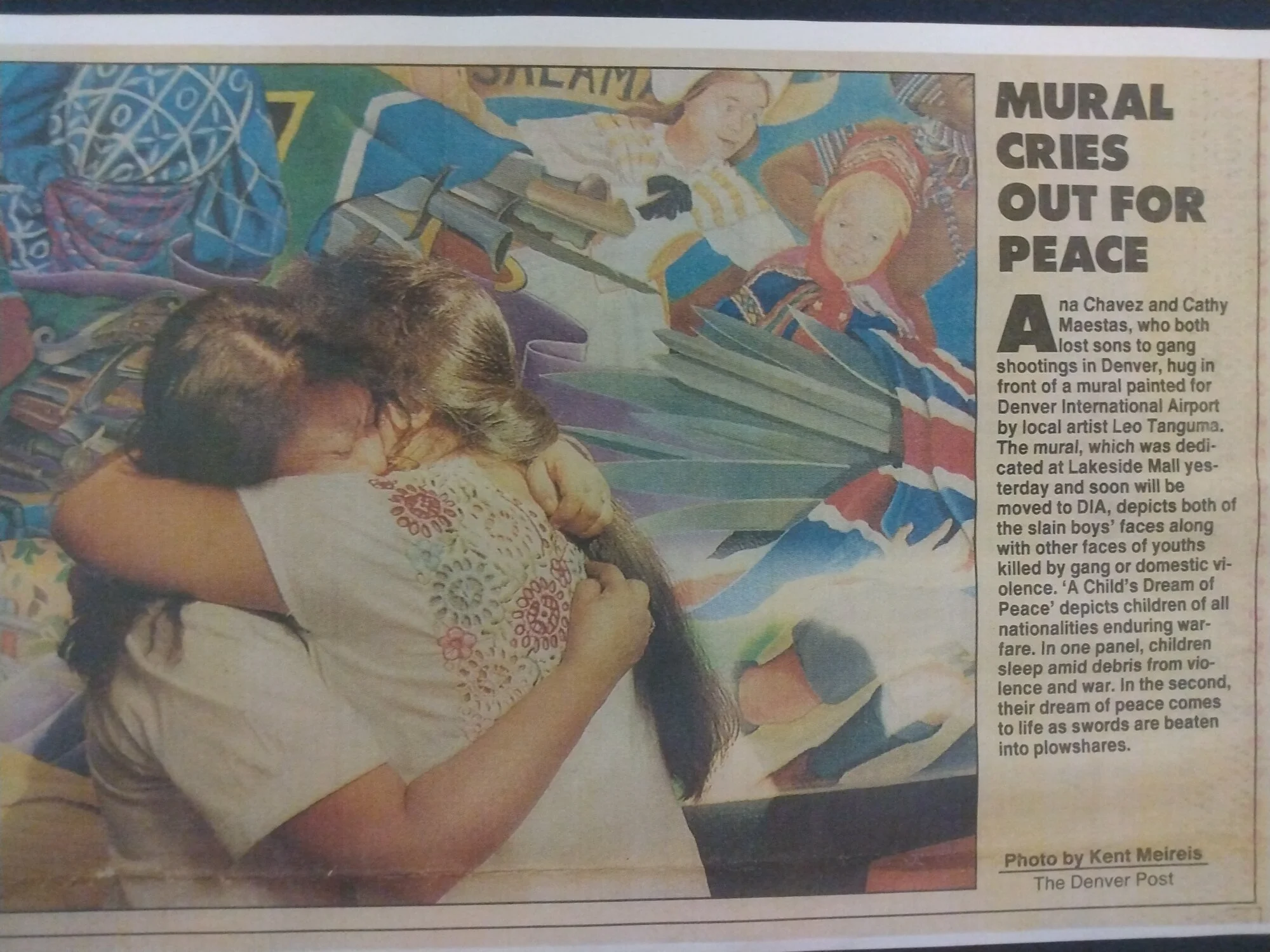 A clip from a Denver Post feature, mothers embrace after seeing their children memorialized in the murals.. Photo courtesy: Leticia Darlina Tanguma