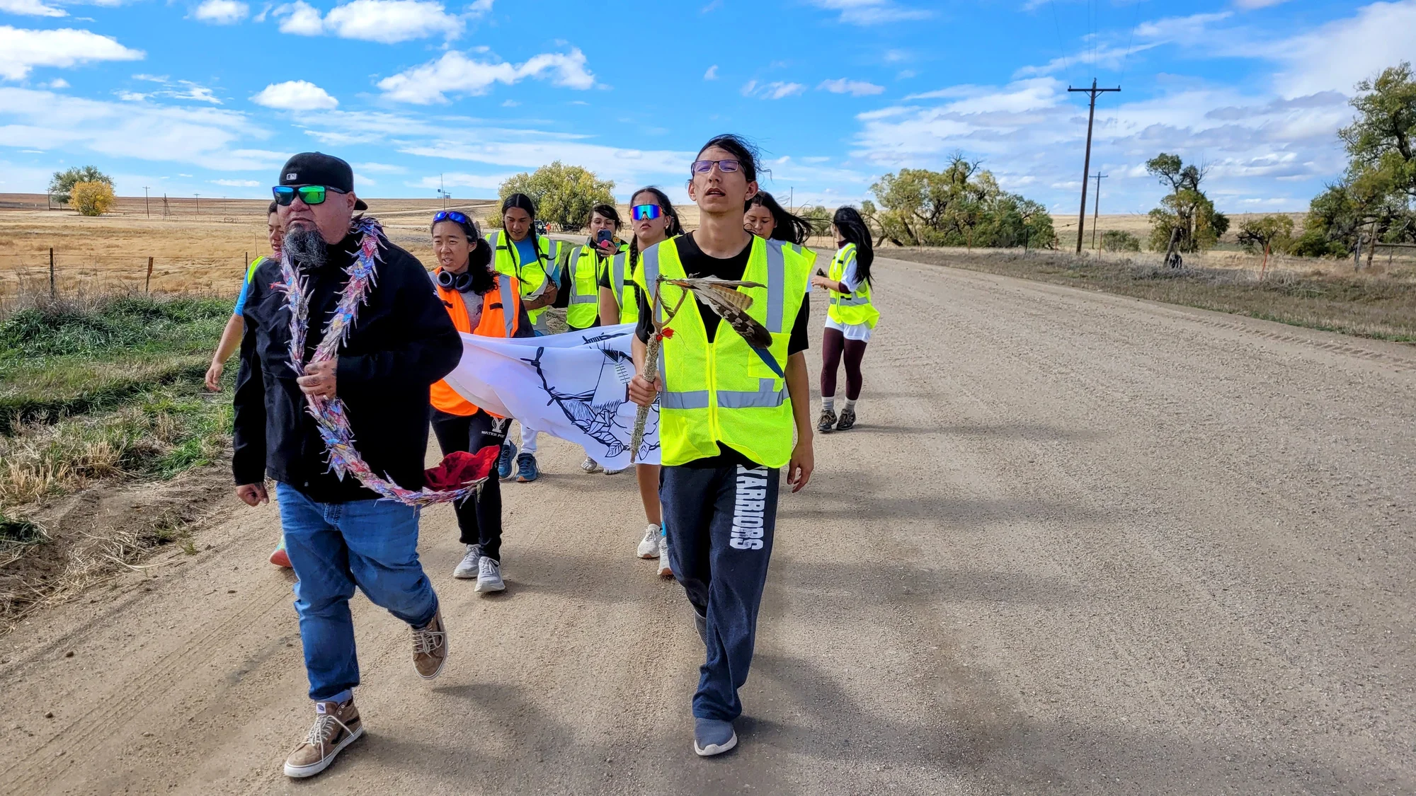 Greg Lamebull and Joshua Beaver lead a group of runners during a stretch of the Sand Creek Massacre Spiritual Healing Run near Agate, Colo on Oct. 19, 2024. Photo: Rae Solomon, KUNC