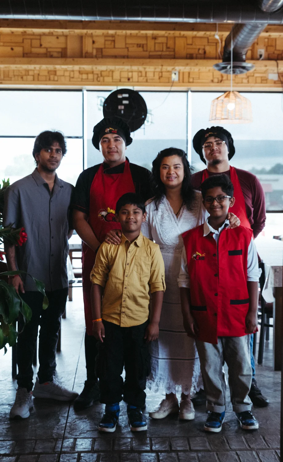 The team and Yadala’s family at the Angry Chicken restaurant. Photo: Peter Vo, Rocky Mountain PBS