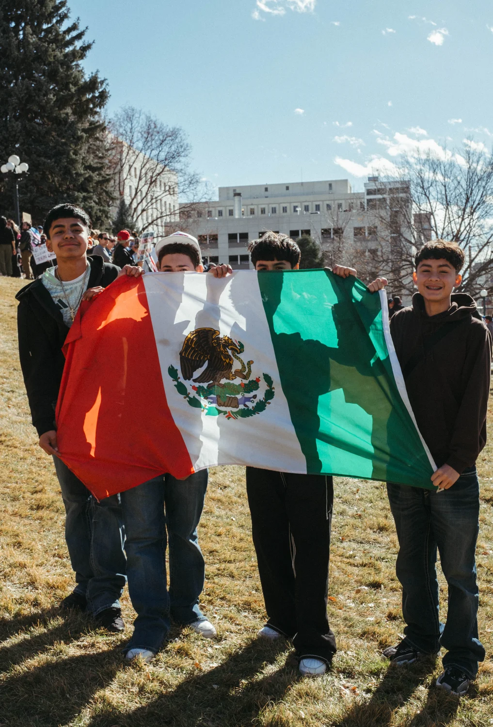 Jesus, Fidel, Julian and Ivan gathered outside the capitol at a protest supporting immigrants’ rights and protesting the Trump administration’s plan for mass deportations. Photo: Peter Vo, Rocky Mountain PBS