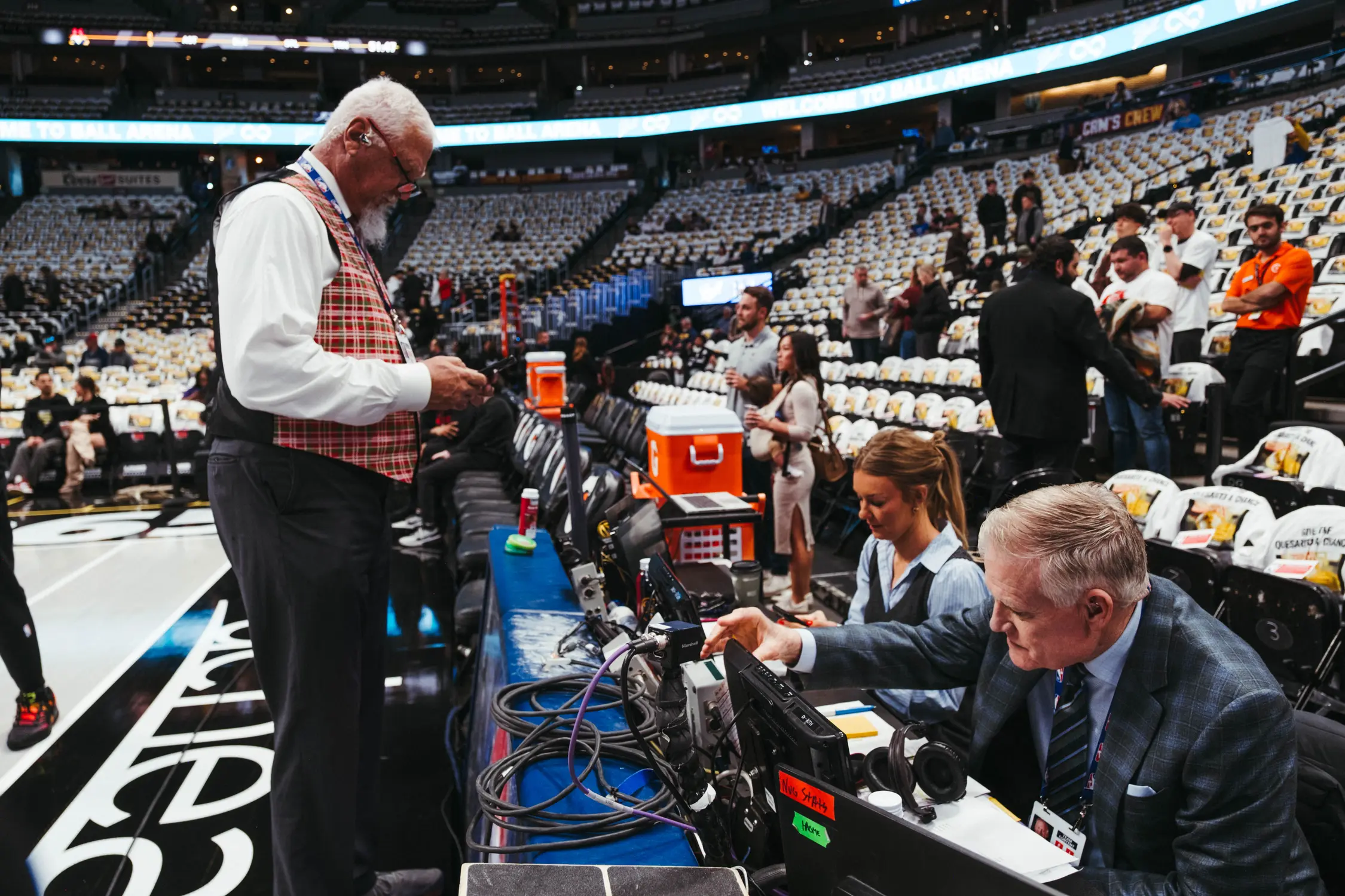 From left to right: Scott Hastings, Katy Winge and Chris Marlowe prepare for a broadcast Saturday, Dec. 20 at Ball Arena. Photo: Peter Vo, Rocky Mountain PBS