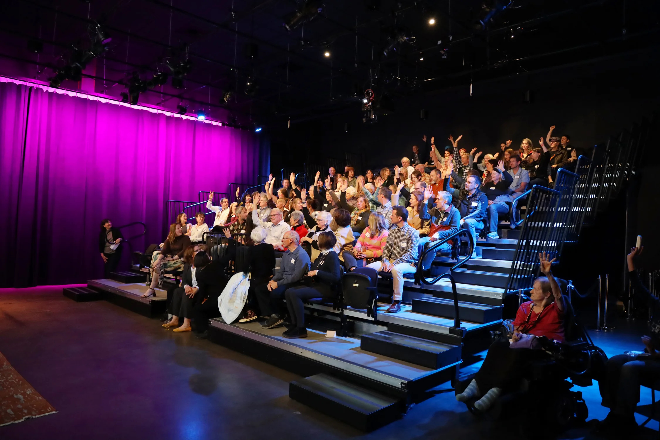 Audience members at Buell Public Media Center raised their hands if they volunteered with the Peace Corps. Photo: Amanda Horvath, Rocky Mountain PBS