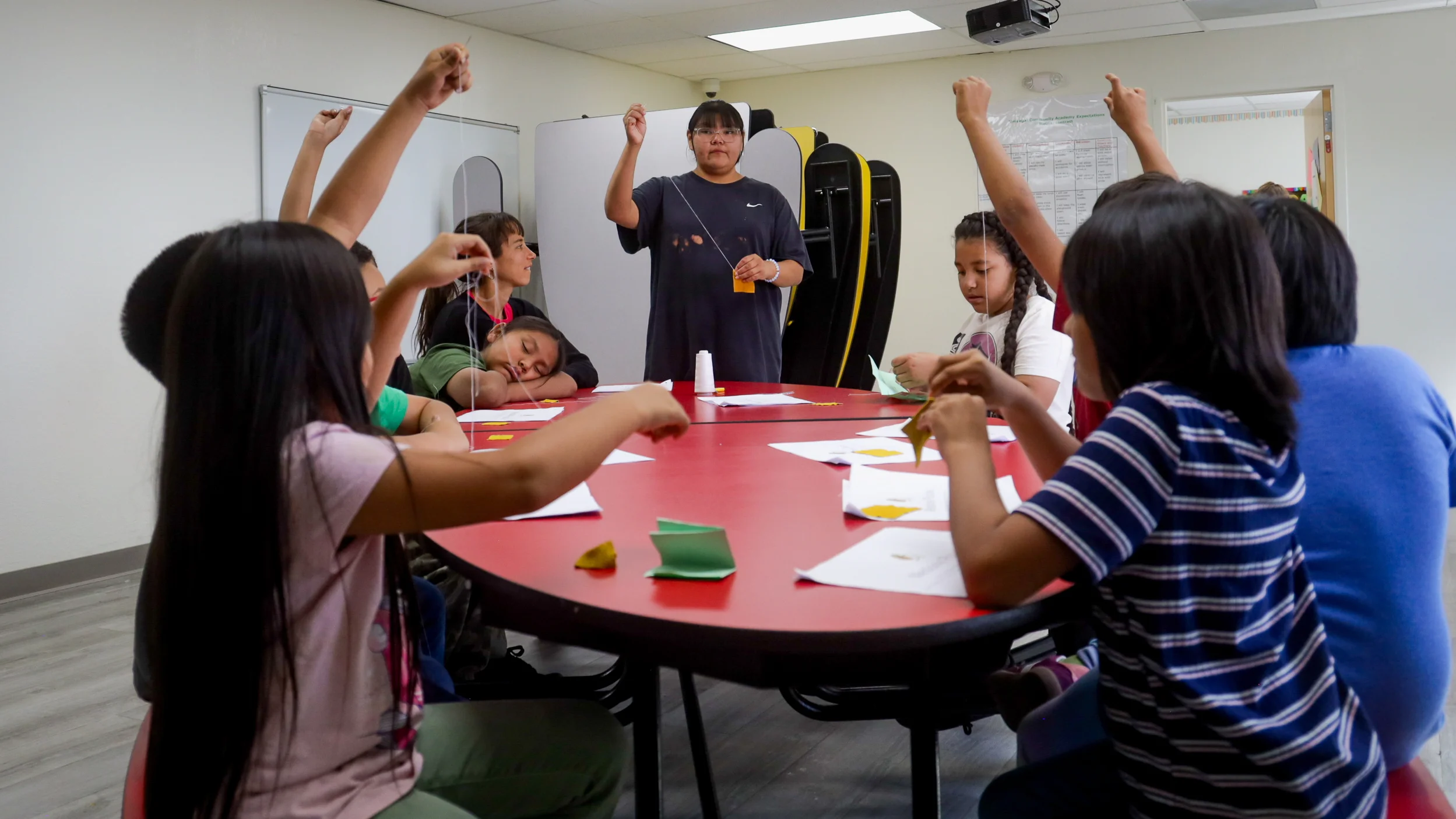 Students learn how to make medicine pouch. Photo: Ziyi Xu, Rocky Mountain PBS