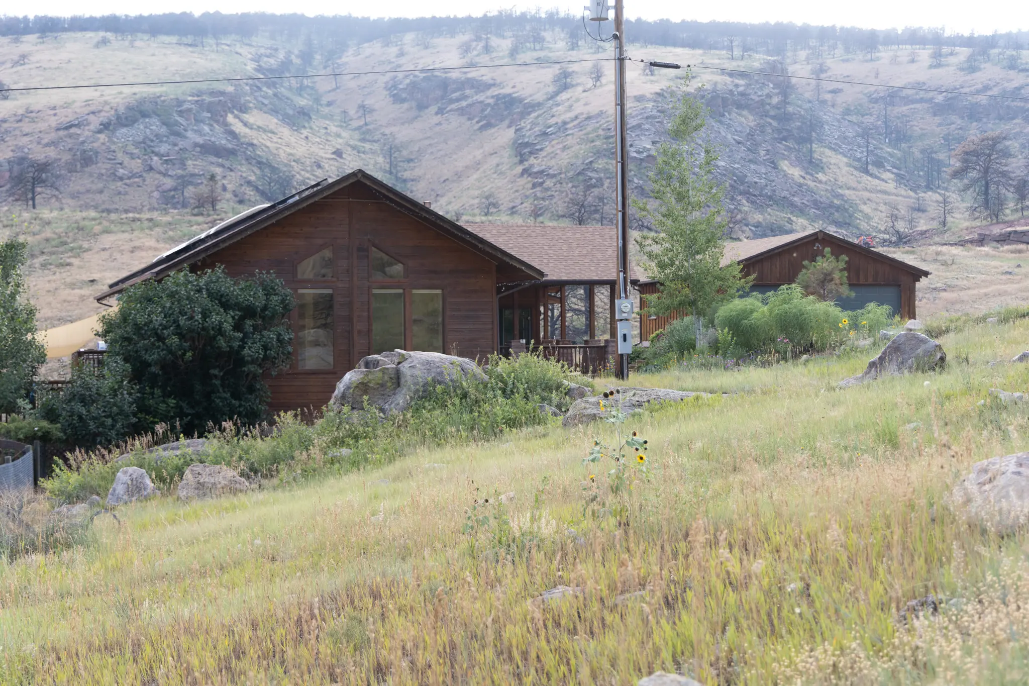 Nick Schneider and Erica Ellingson’s wooden home outside Lyons, Colorado.  Photo: Amanda Horvath, Rocky Mountain PBS