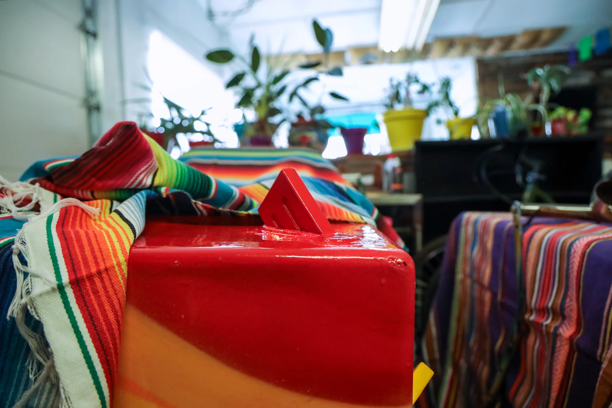 Thomas “Detour” Evans painted a cart for the exhibit. Photo: Carly Rose, Rocky Mountain PBS