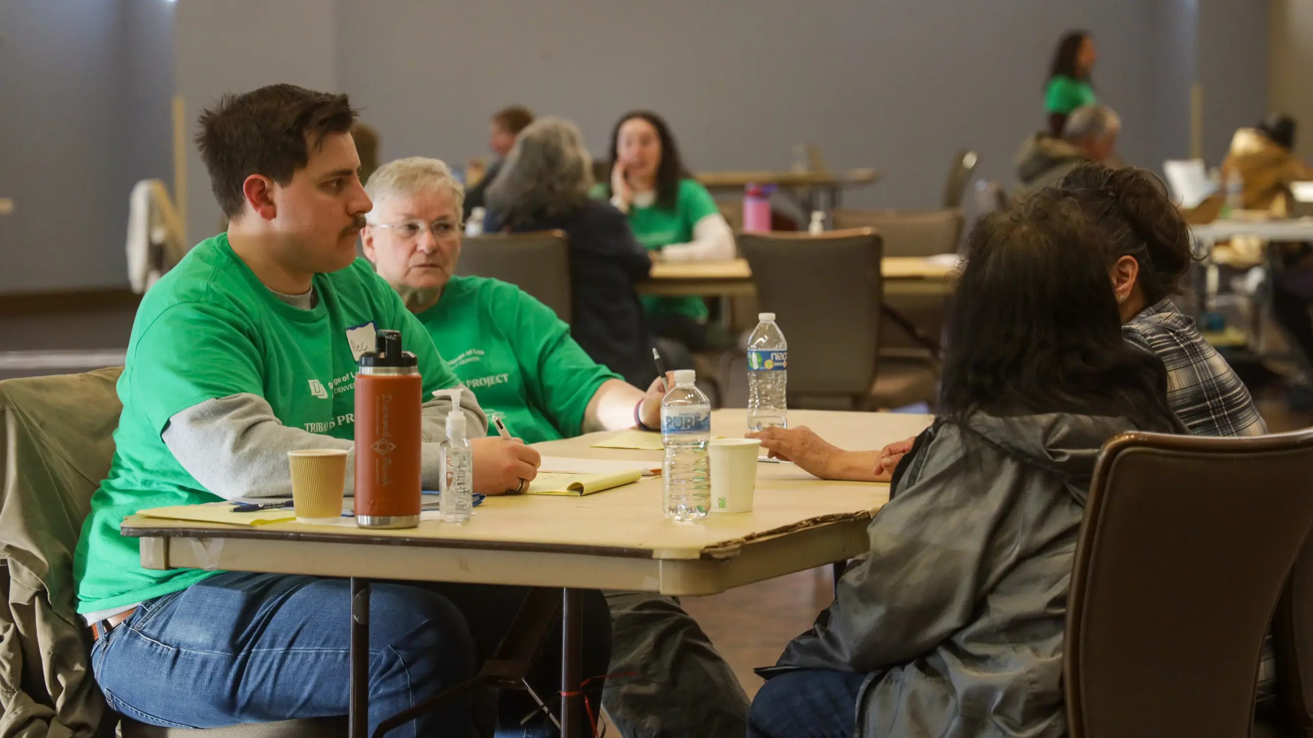 A law student and supervising attorney meet with clients. Photo: Ziyi Xu, Rocky Mountain PBS