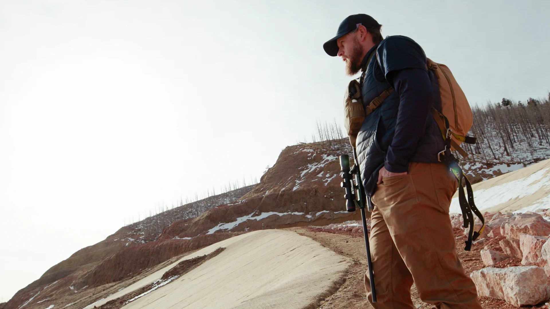 Ty Woodward ascends the terraced slopes of Pikeview Quarry. For a good shot he must get within 25 yards of the bighorn sheep. Photo: Cormac McCrimmon, Rocky Mountain PBS