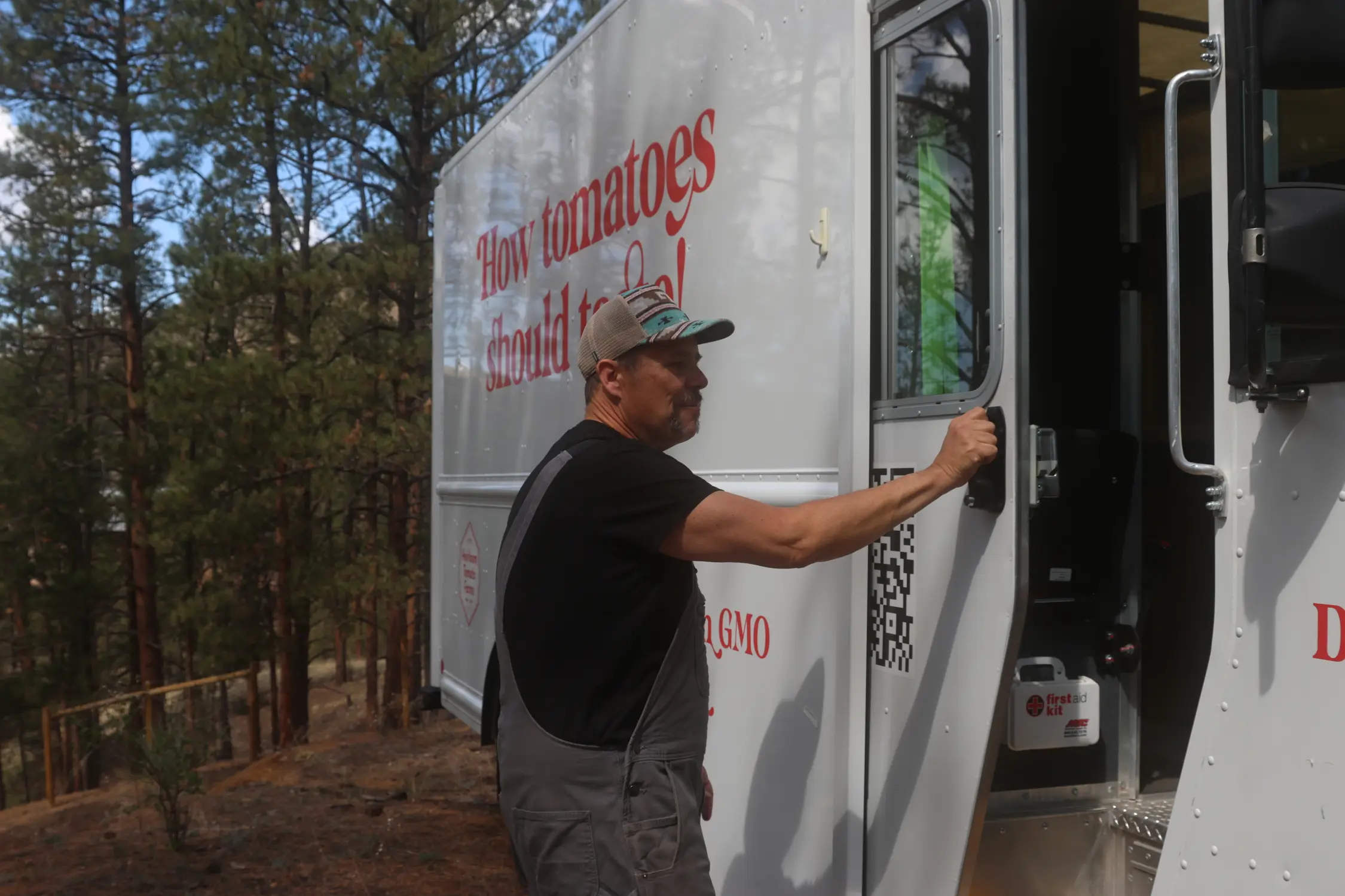 Weil opens the door to his tomato delivery truck, Dester. Photo: Kyle Cooke, Rocky Mountain PBS