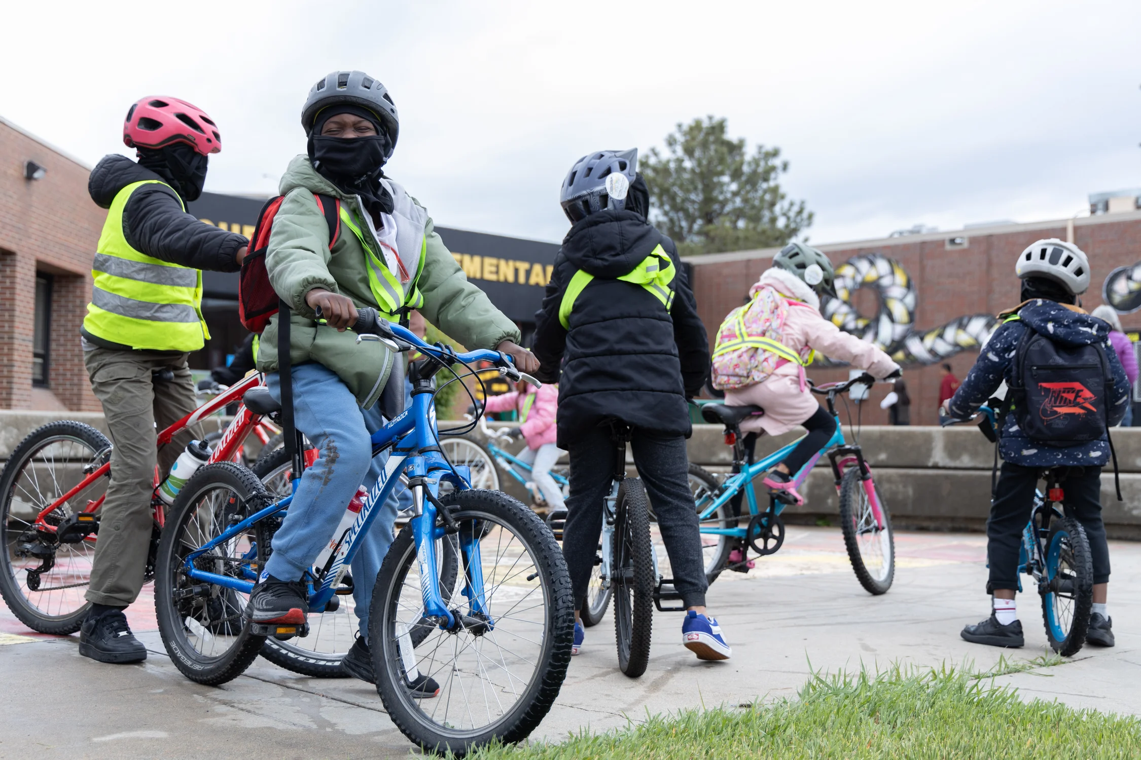 Students are required to wear helmets on Denver’s bike buses. Some buses also require students to wear bright clothing or reflective safety vests. Photo: Andrea Kramar, Rocky Mountain PBS